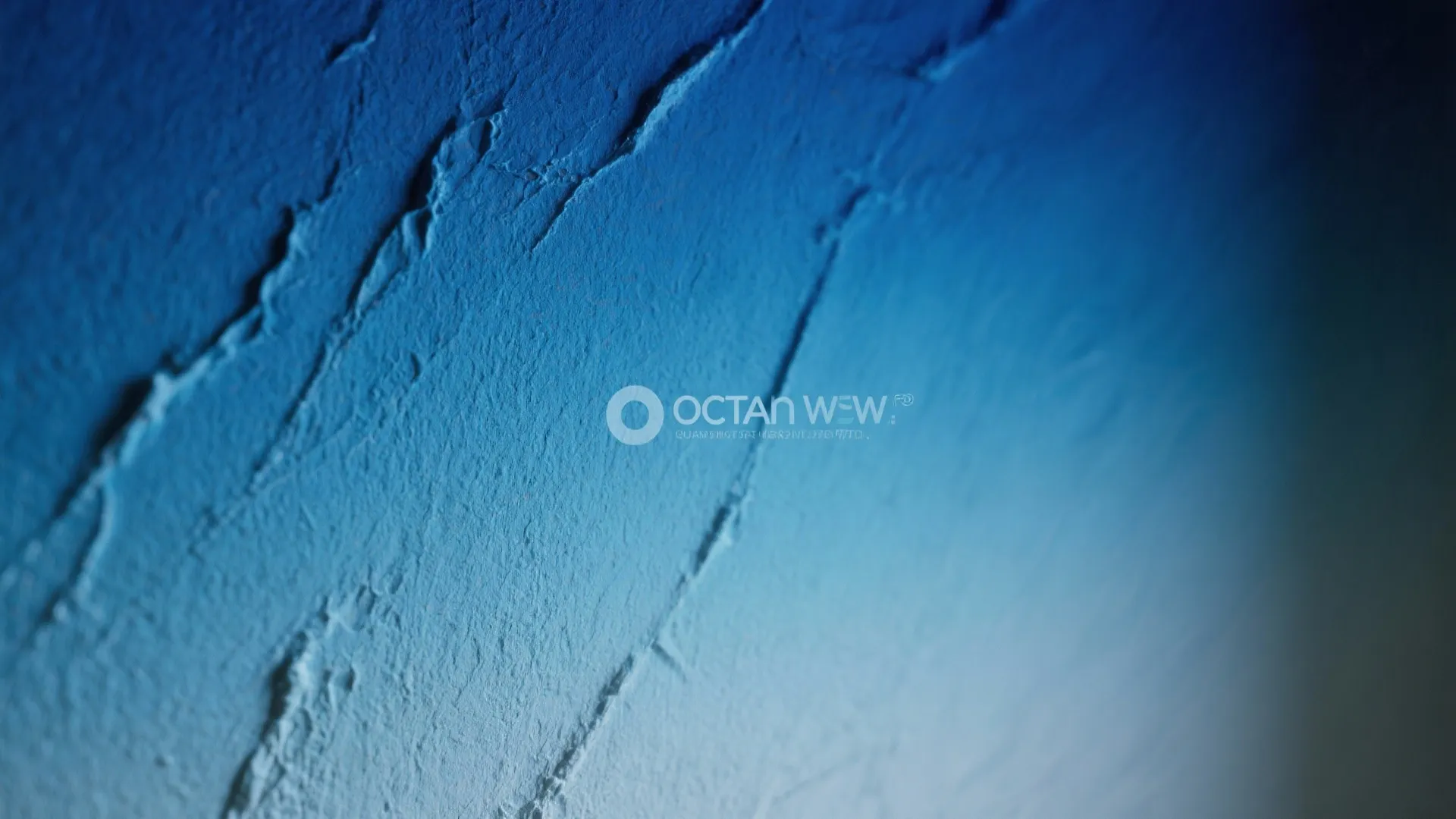 Close up view of a blue textured wall with thick paint strokes and light effects