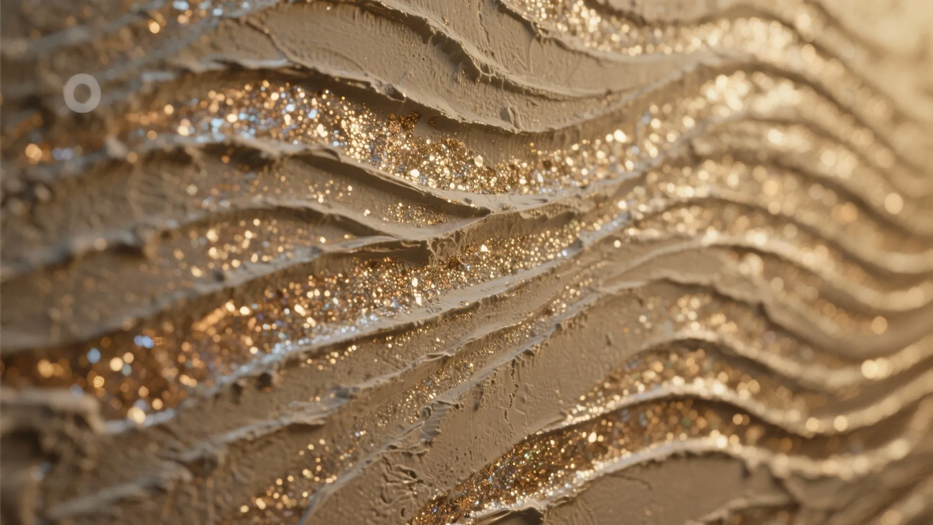 Close up of beige textured wall paint with sparkling gold glitter in a wavy pattern design