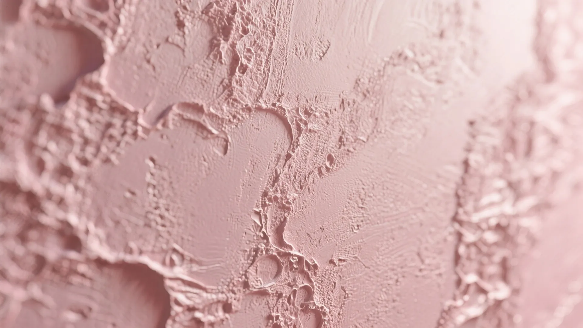 Close-up of dusty pink textured Venetian plaster wall