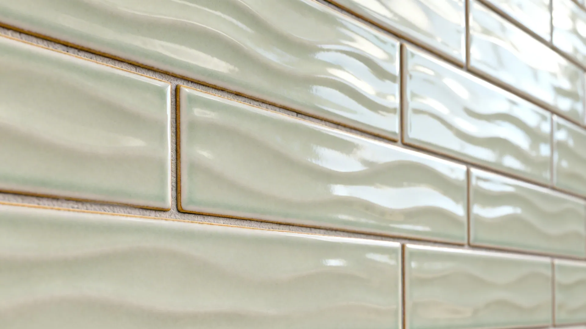 Close-up of glossy ripple subway tiles in a vertical stack pattern with neat grout lines.