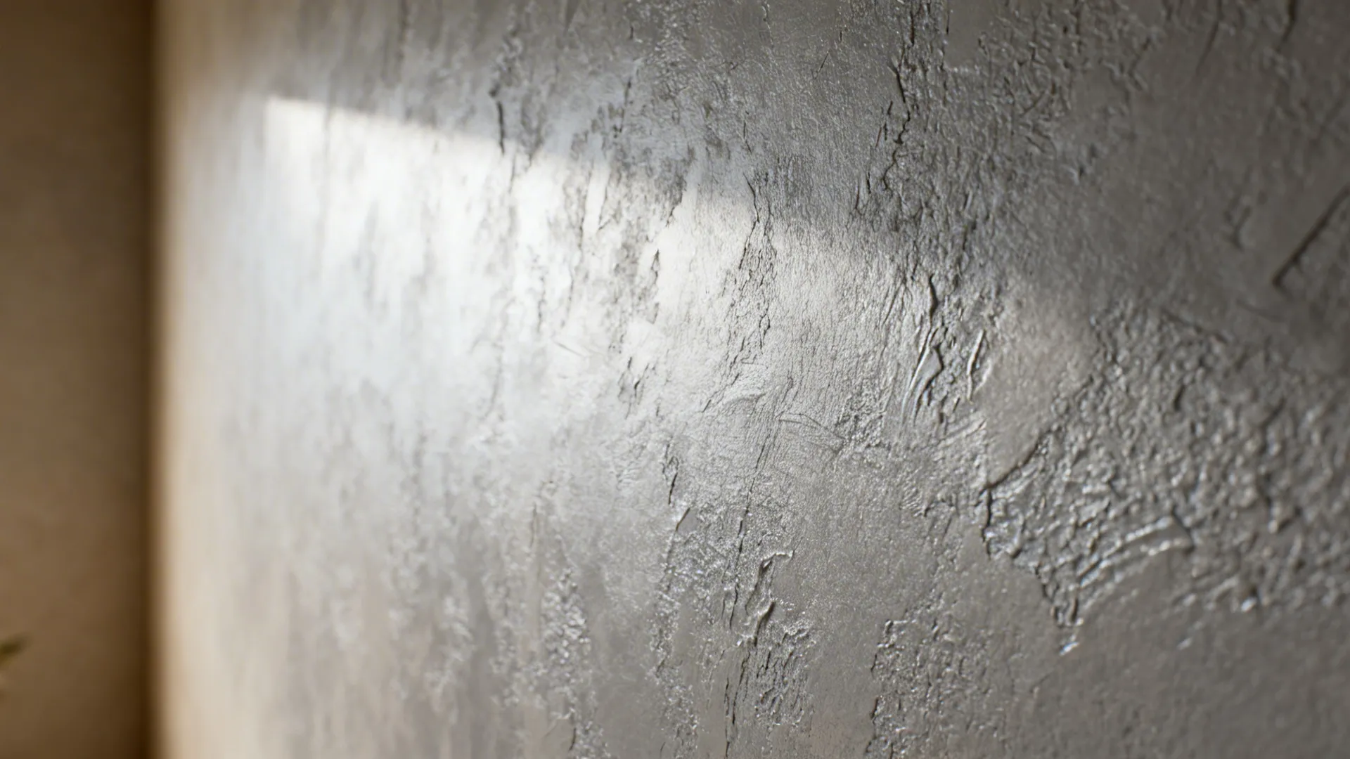 Close-up of textured gray Venetian plaster accent wall showing tactile finish