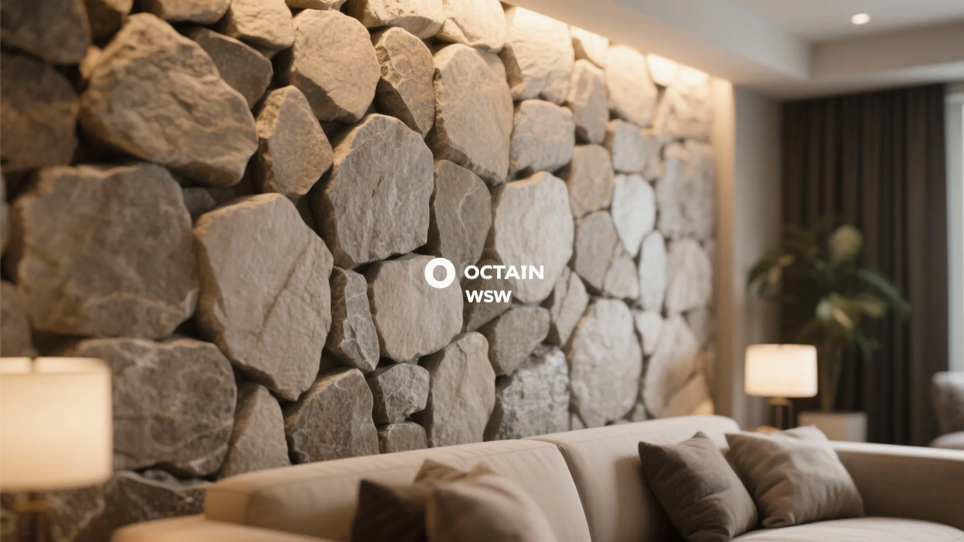 Living room featuring a large natural stone wall panel behind a sofa with warm indoor lighting