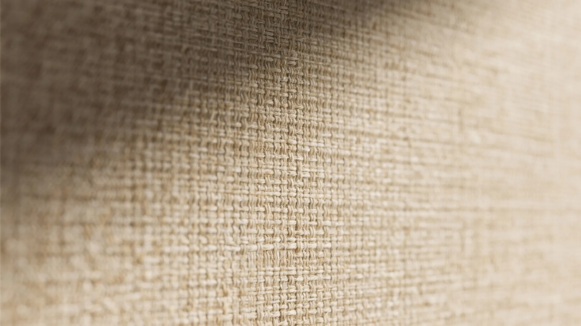 Macro close-up of grasscloth textured wallpaper showing natural weave and fibers