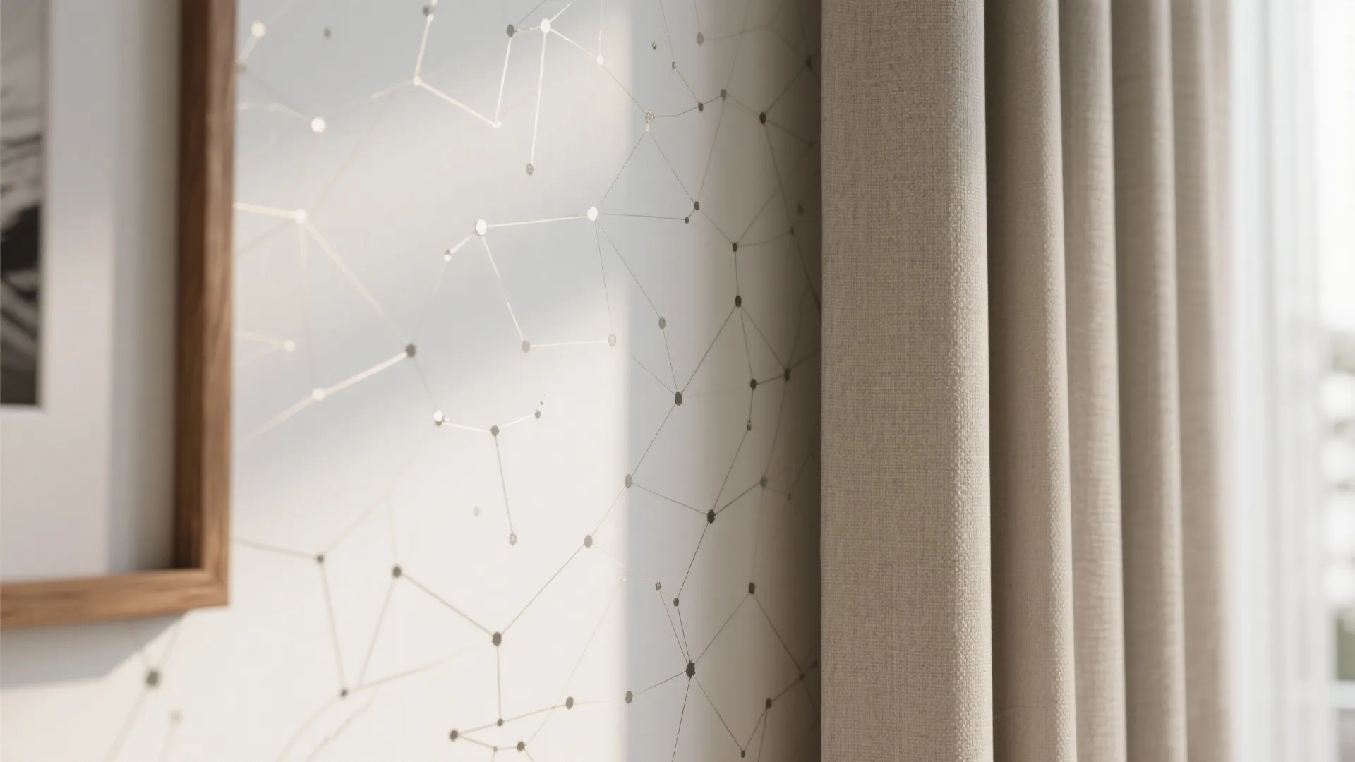 Geometric pattern wallpaper next to a wooden picture frame and thick beige fabric window curtain