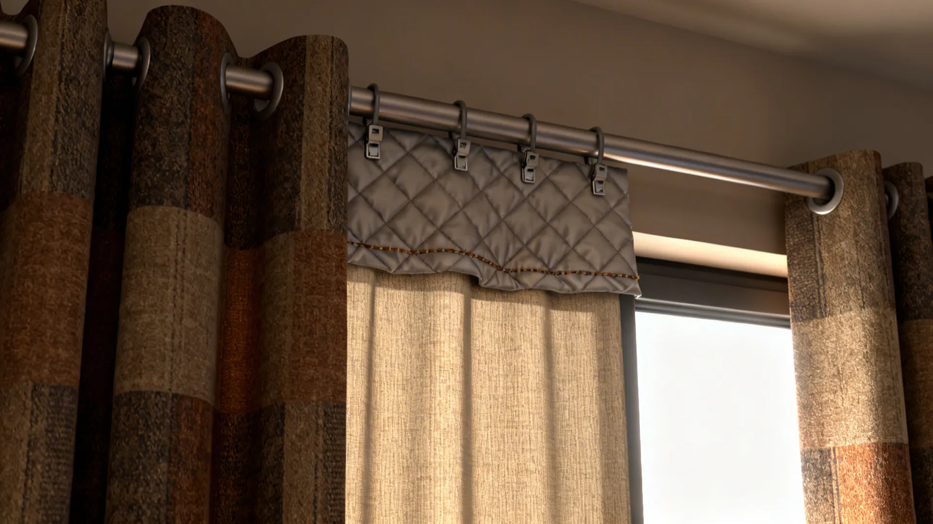 Close up of patterned curtains and grey quilted liner hanging on metal rod near window