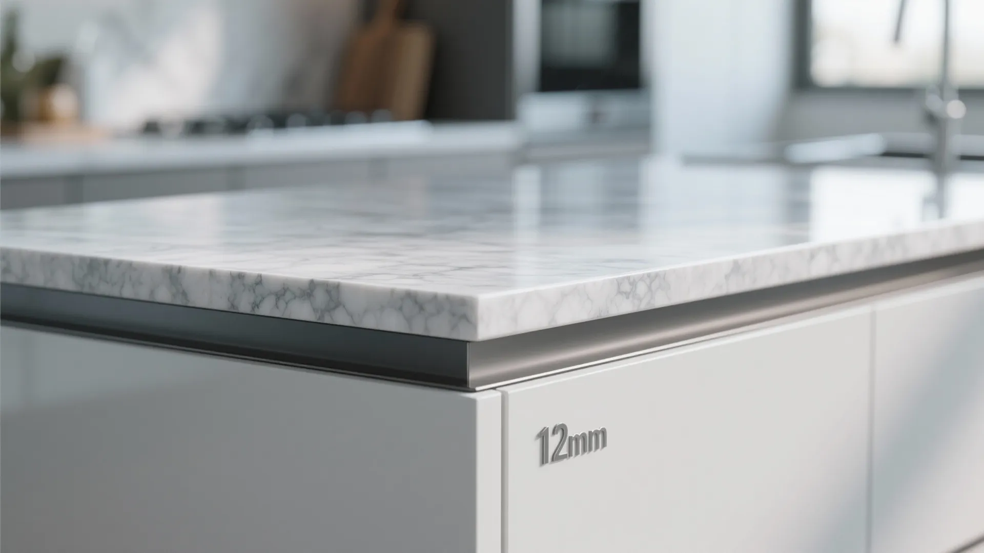Close up of a twelve millimeter white marble stone kitchen countertop edge on white cabinets