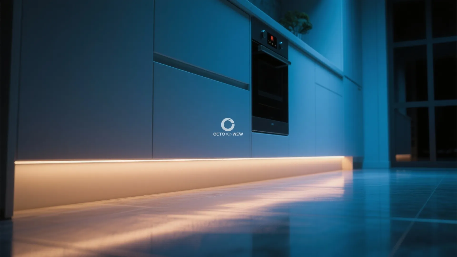 Hidden LED strip lighting under kitchen cabinets creating a soft glow.