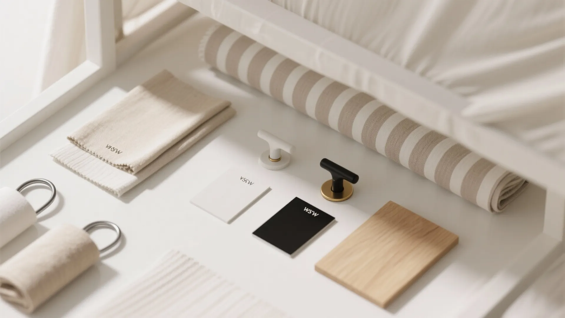 Flatlay of warm white paint chips, oatmeal linens, subtle pinstripe fabric, and matte metal finishes for a tone-on-tone canopy.
