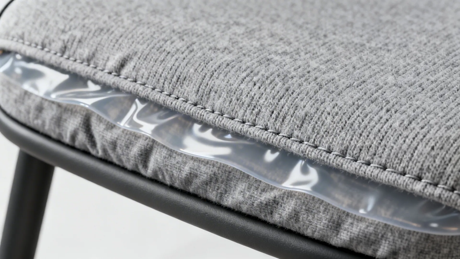 Macro detail of brushed knit face with underlying thin TPU waterproof membrane and neat stitching.