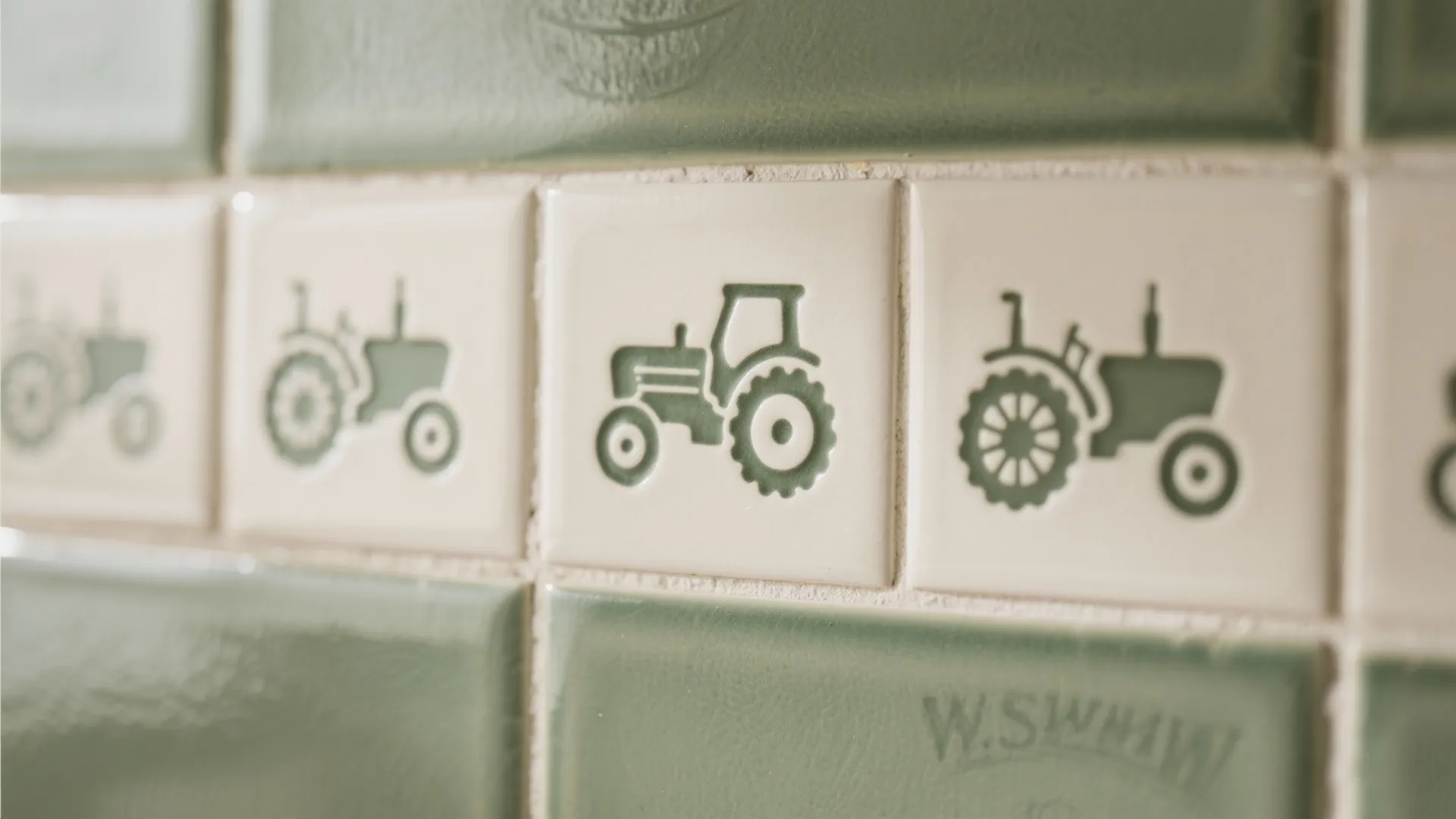 Ceramic backsplash tiles with subtle tractor motifs