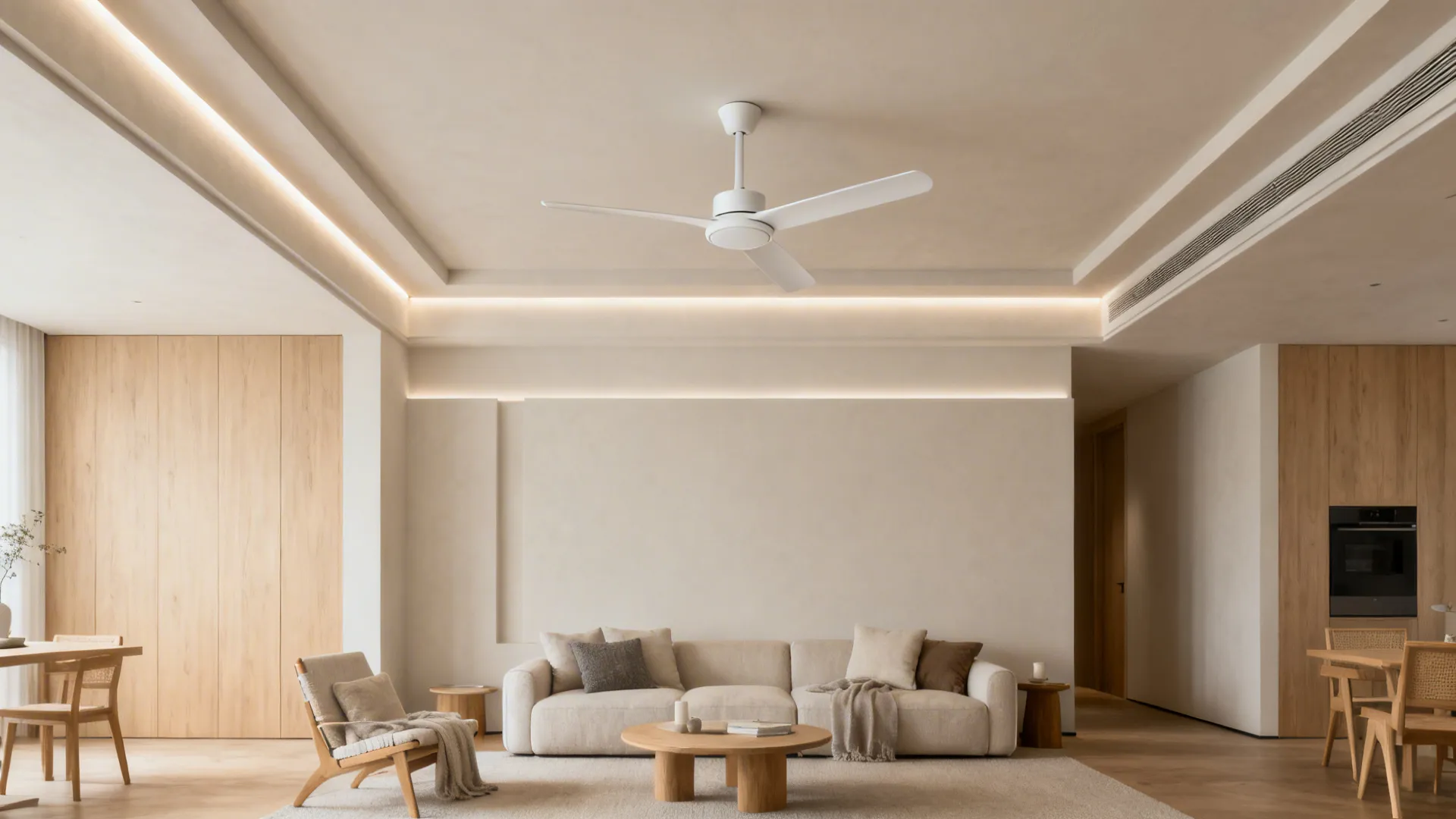 Minimalist tray ceiling with indirect LEDs and a slim matte white DC fan over a modern sofa.