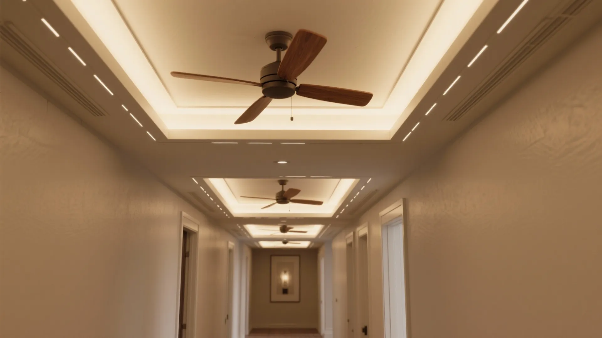 Long hallway with multiple ceiling fans and warm light fixtures installed in a decorative ceiling