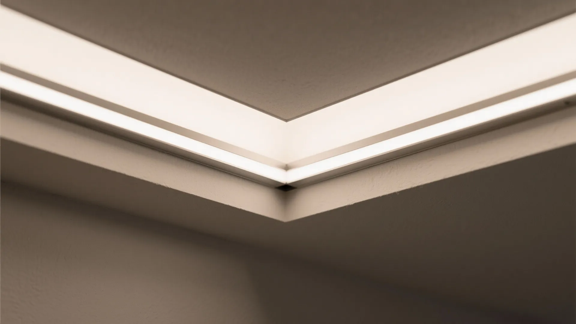 Macro detail of tray ceiling edge with opal diffuser and soft warm light.