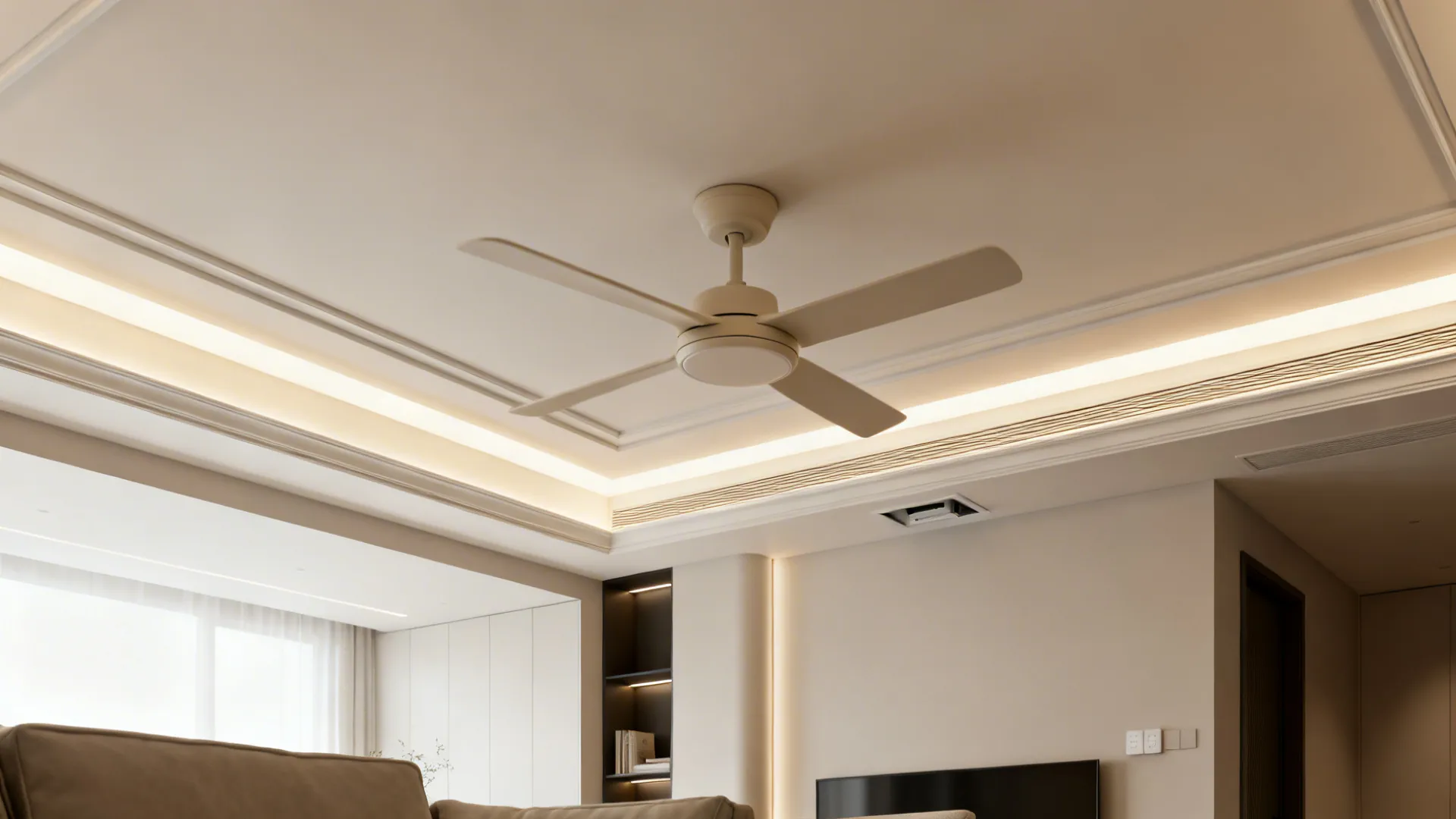Gypsum tray ceiling with recessed low-profile fan and dimmable cove lighting.