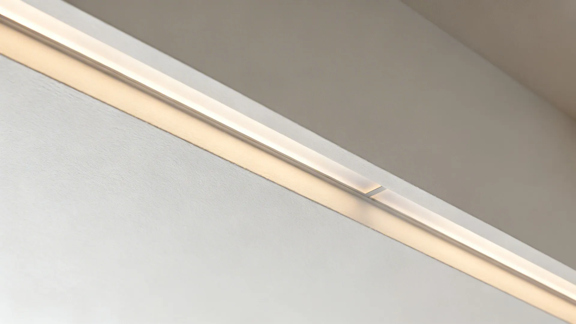 Macro of floating tray reveal with frosted LED channel casting gentle uplight.