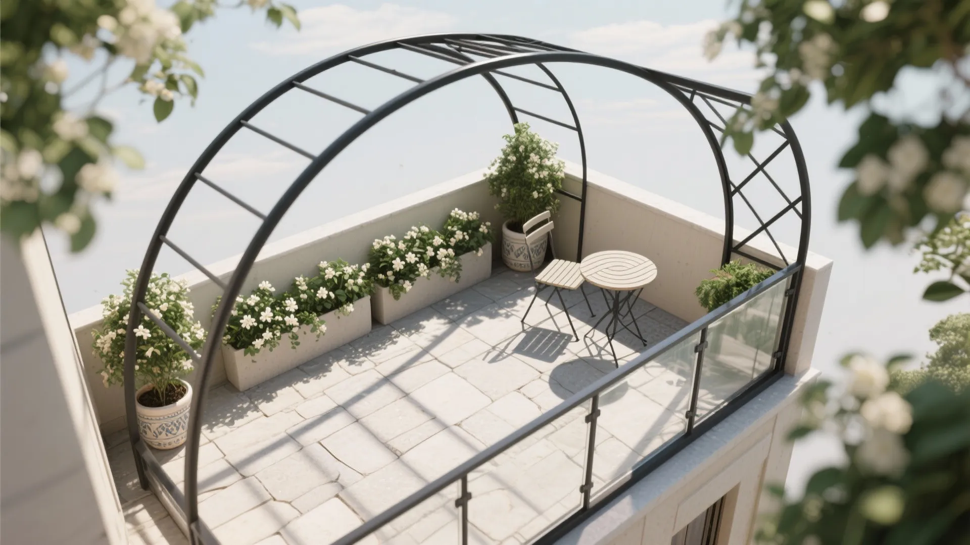 Outdoor rooftop terrace with black metal arch frame, white flowers, small table, and two chairs