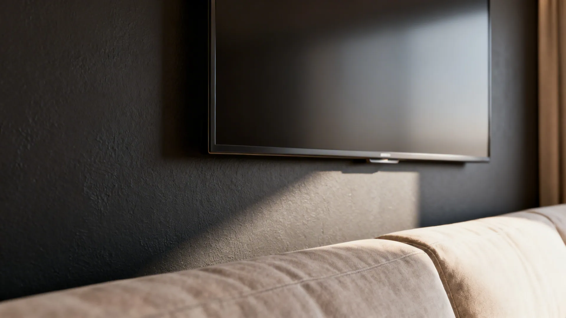 Matte-screen 40-inch TV on a slightly darker accent wall blending into the room