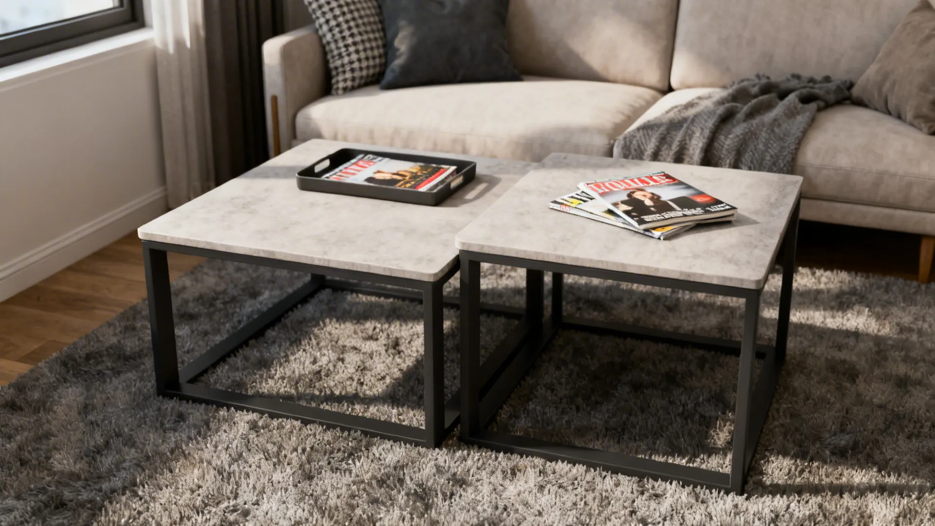 Two square marble coffee tables with black metal frames on grey rug in bright room