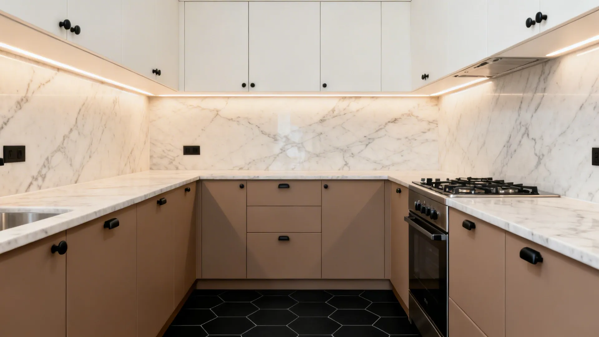 Two-tone kitchen with white uppers, taupe lowers, and a matte black floor with veined countertop.
