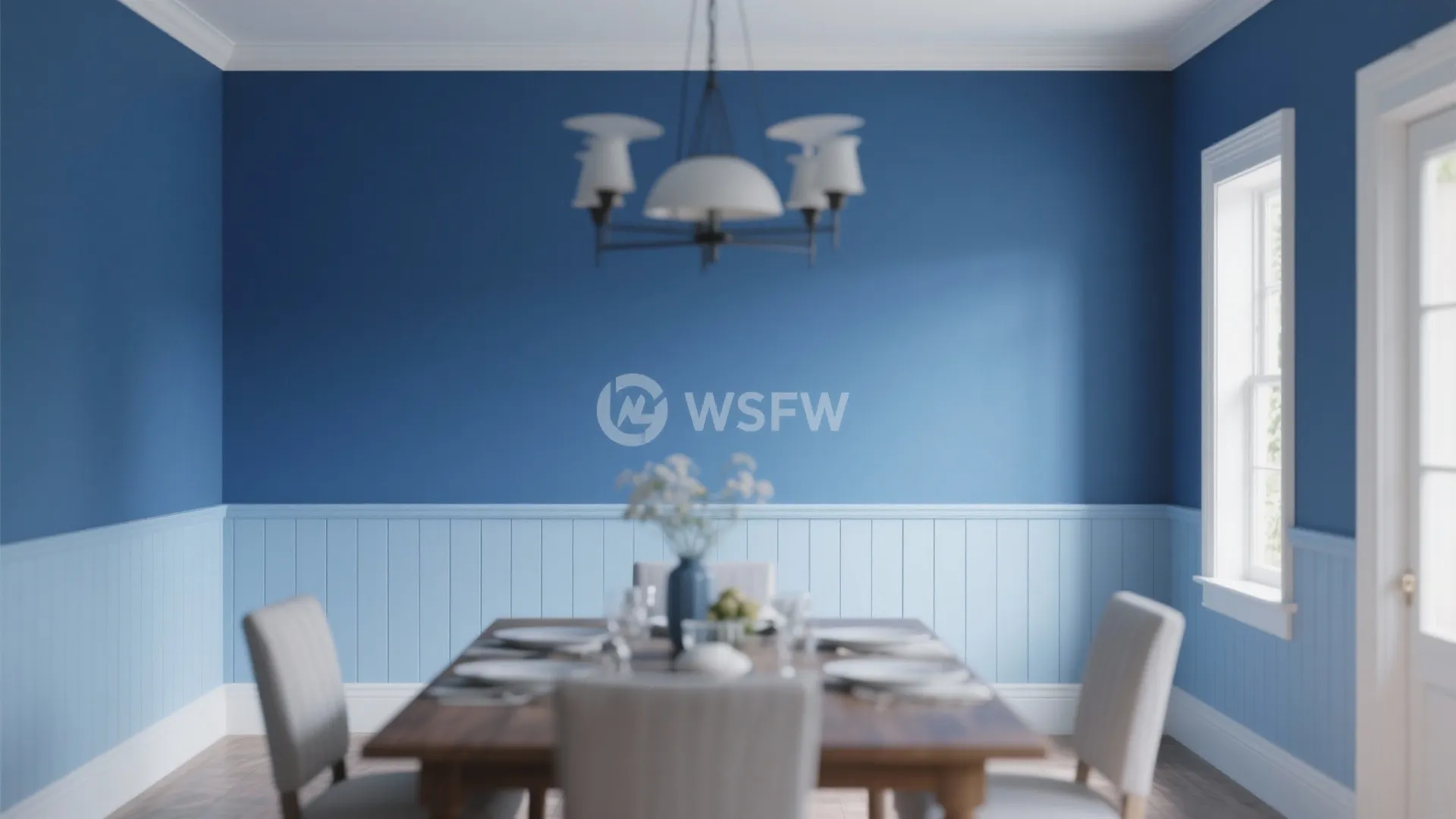 Dining room with blue two tone walls light blue wall panel wooden table and ceiling light