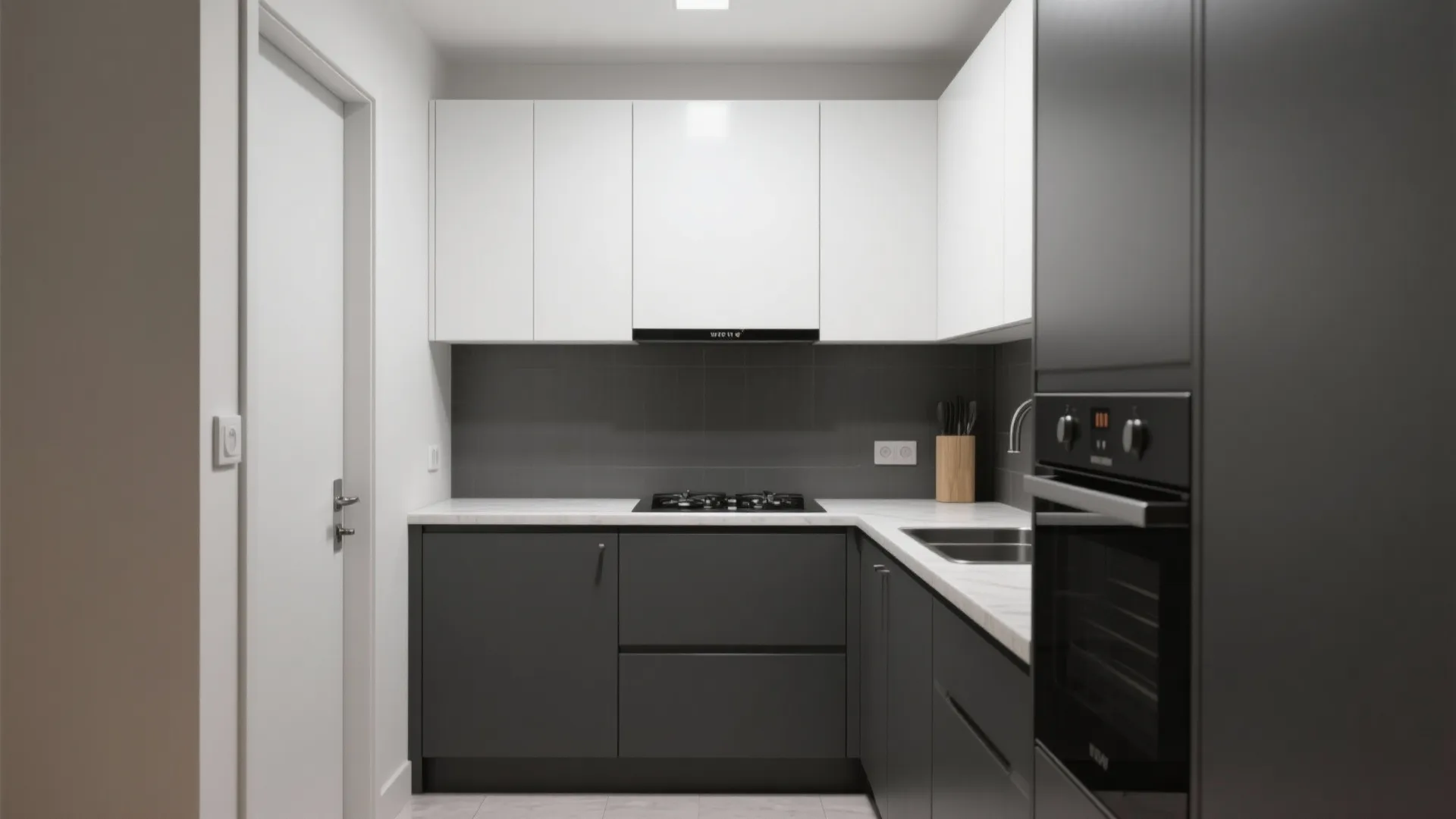 Modern kitchen with white upper cabinets and dark grey lower cabinets including built in oven