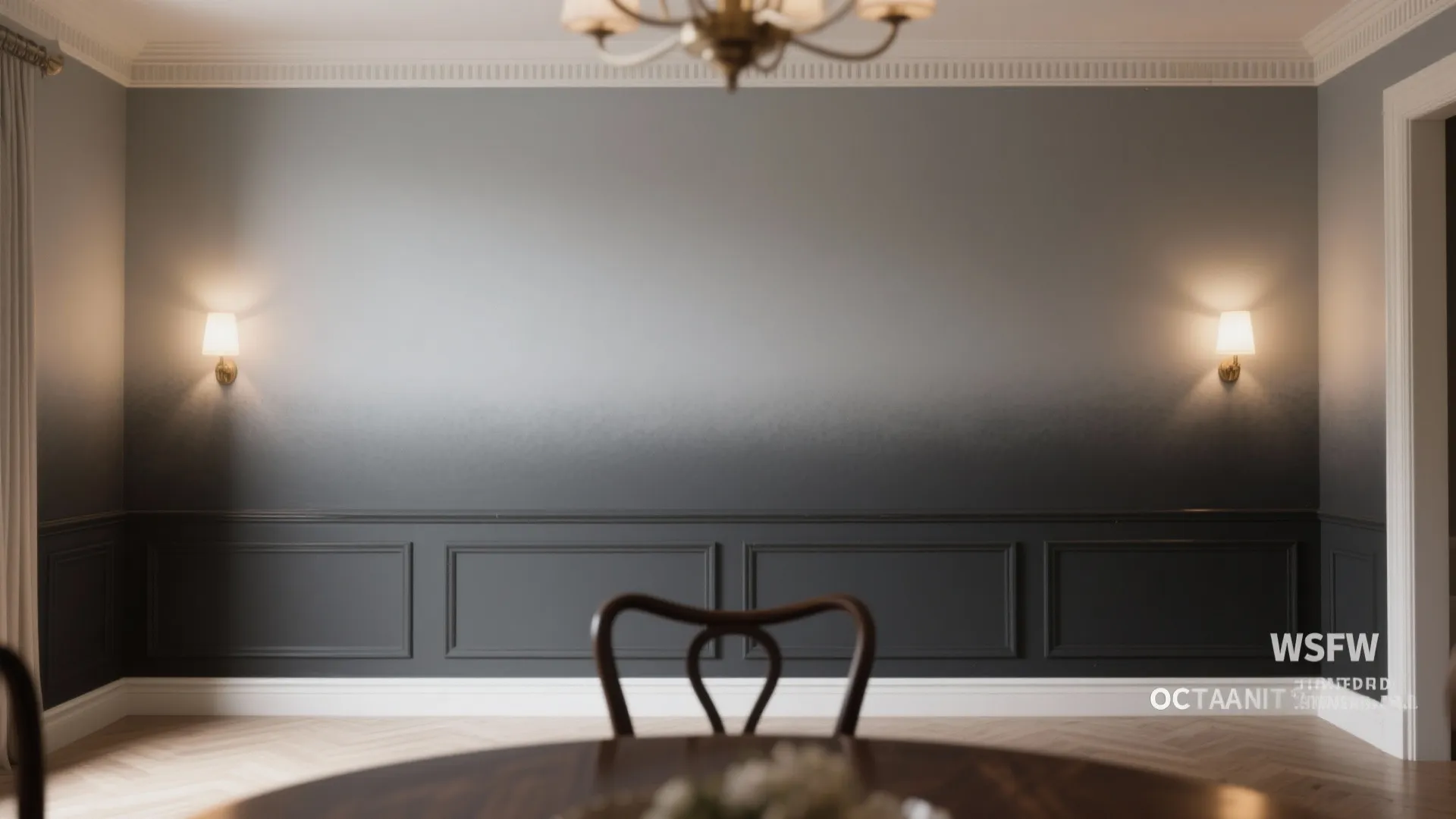 Dining room with grey gradient wall paint dark wall panel two wall lights and chair