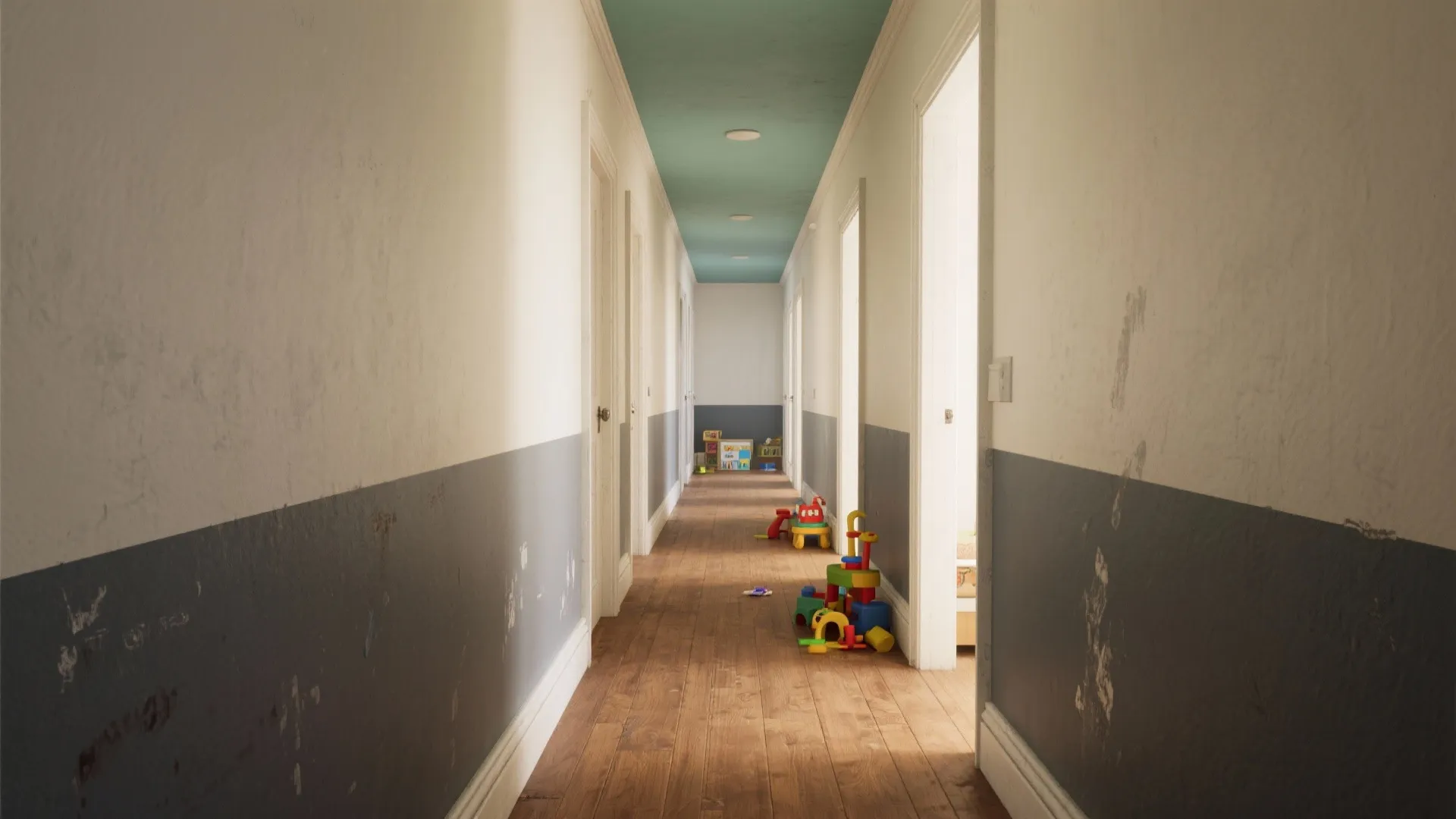 Long hallway with two-tone grey and white wall panels, teal ceiling, and children's colorful toys