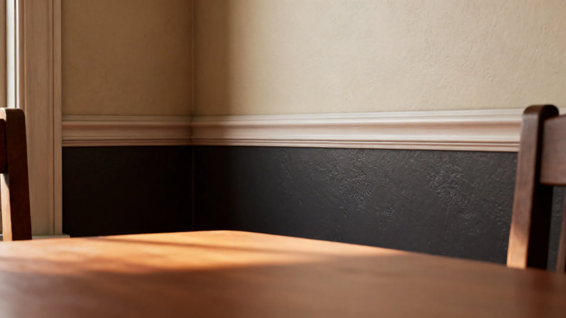 Dining nook with darker lower wall and lighter upper wall separated by a slim chair rail molding.