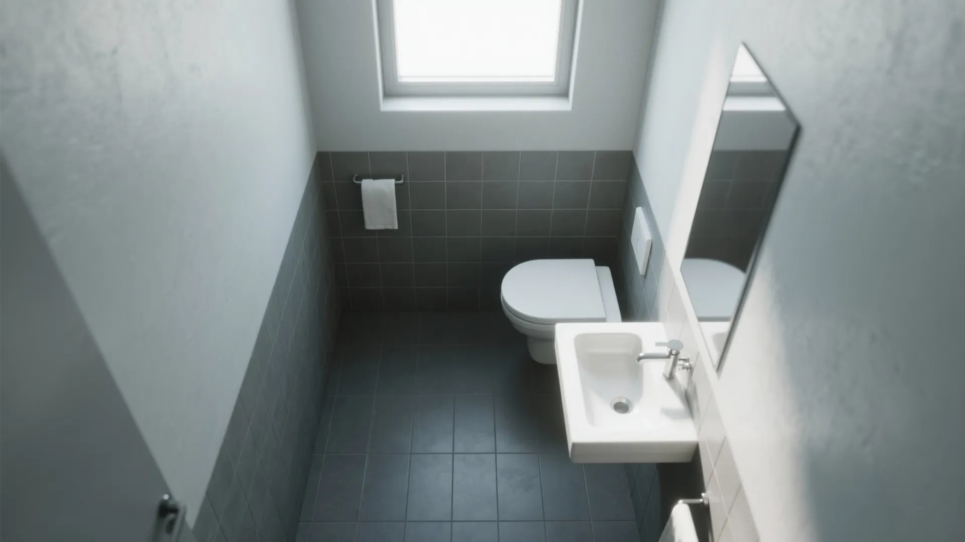 Small modern bathroom with grey floor tiles white sink white toilet and a small window