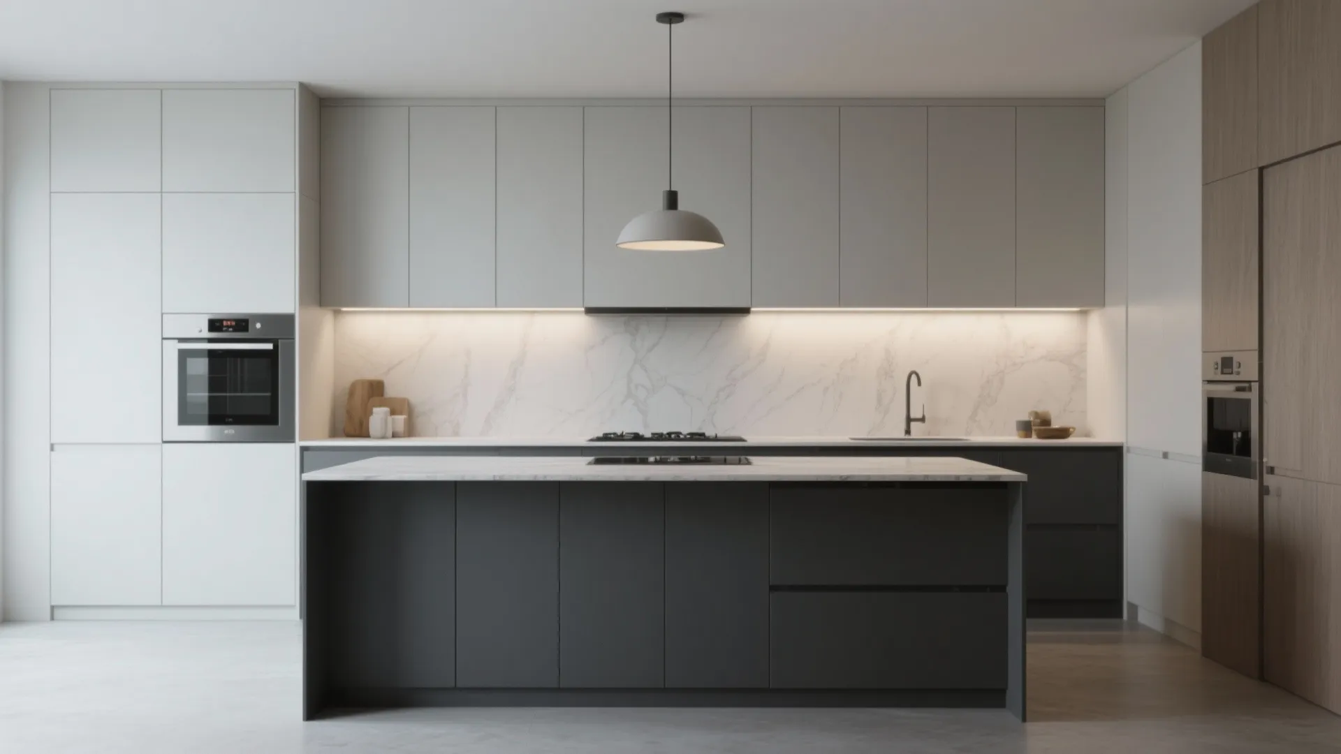 Minimalist kitchen with dark grey island and white marble backsplash featuring modern ceiling light fixture above