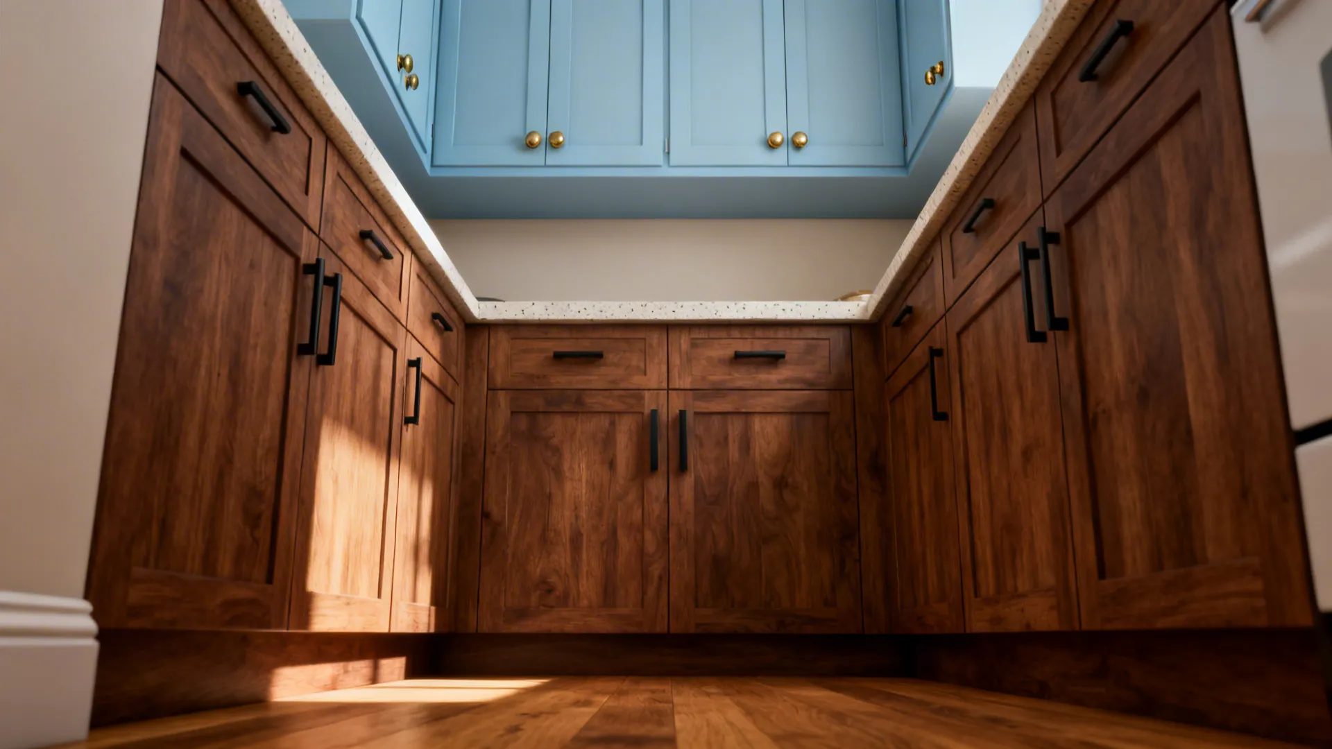 Small kitchen with walnut base cabinets and pale blue uppers in soft daylight.