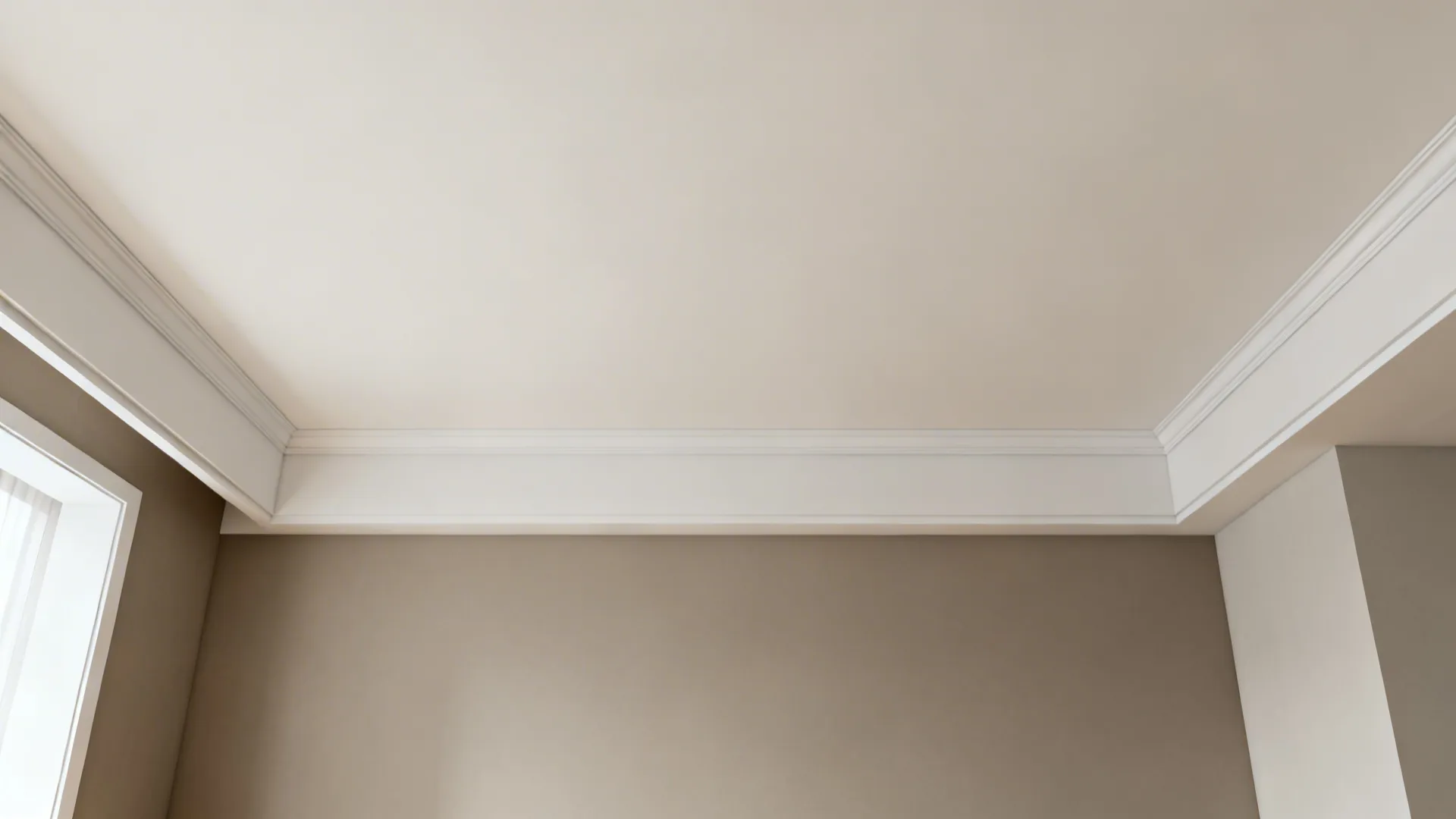 Two-tone living room with lighter ceiling and upper wall, deeper neutral below, and a slim picture rail.