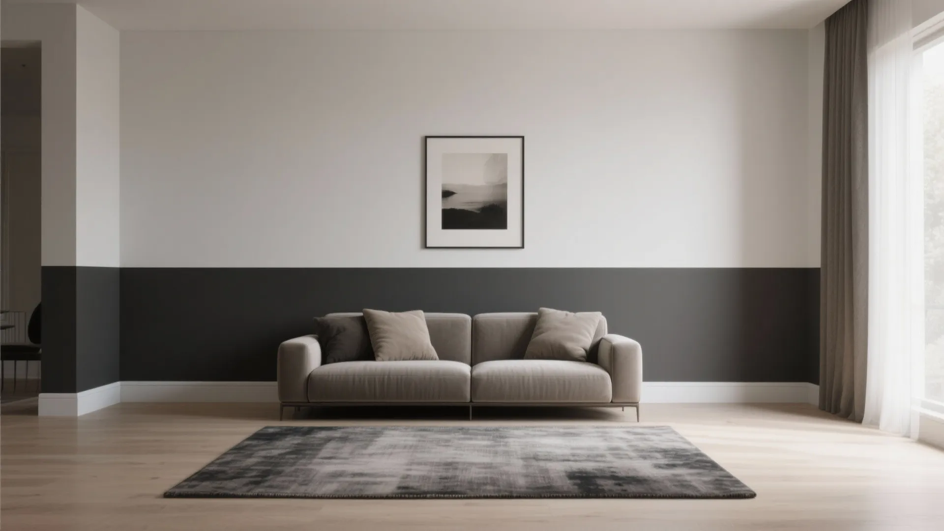 Modern living room featuring two tone grey and white walls with sofa and framed art