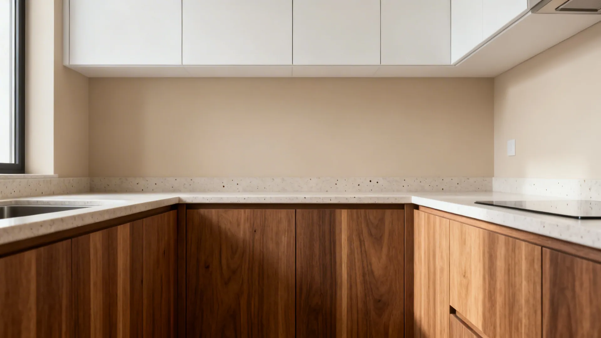 Modern kitchen featuring white wall cabinets warm wood base cabinets and a clean white stone countertop