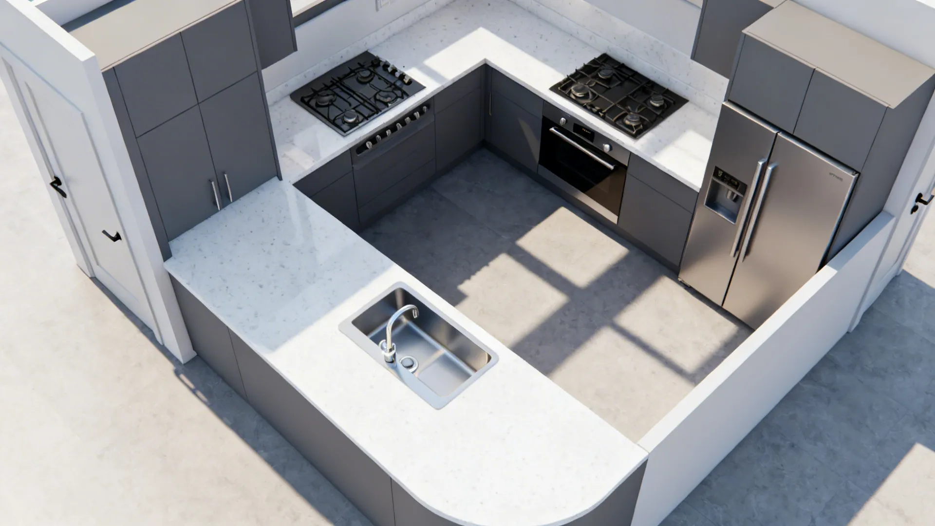 Overhead view of U-shaped kitchen with grey cabinets white countertops sink stove and stainless refrigerator