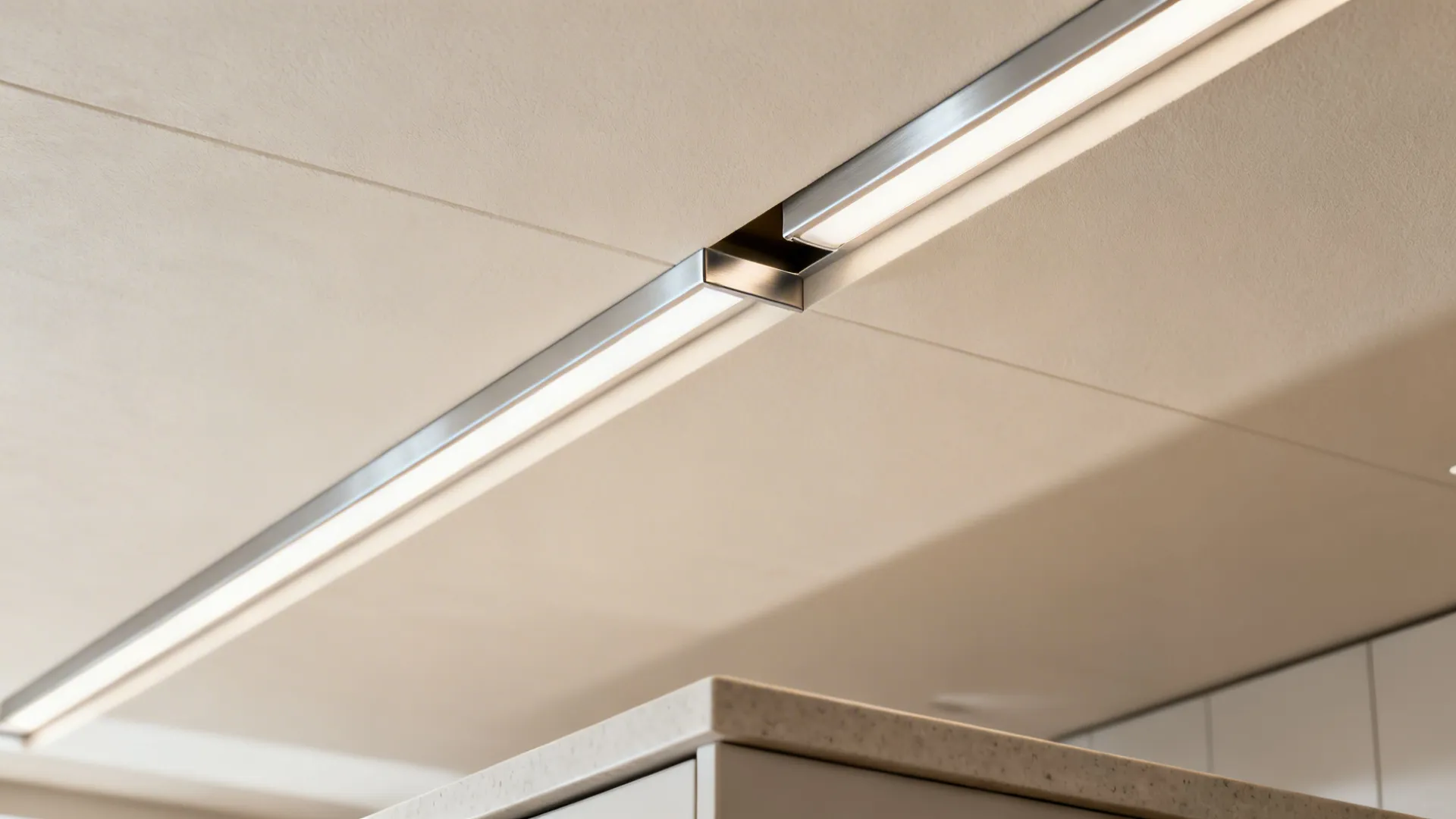 Macro view of recessed ultra-slim LED channel in a minimal gypsum ceiling.