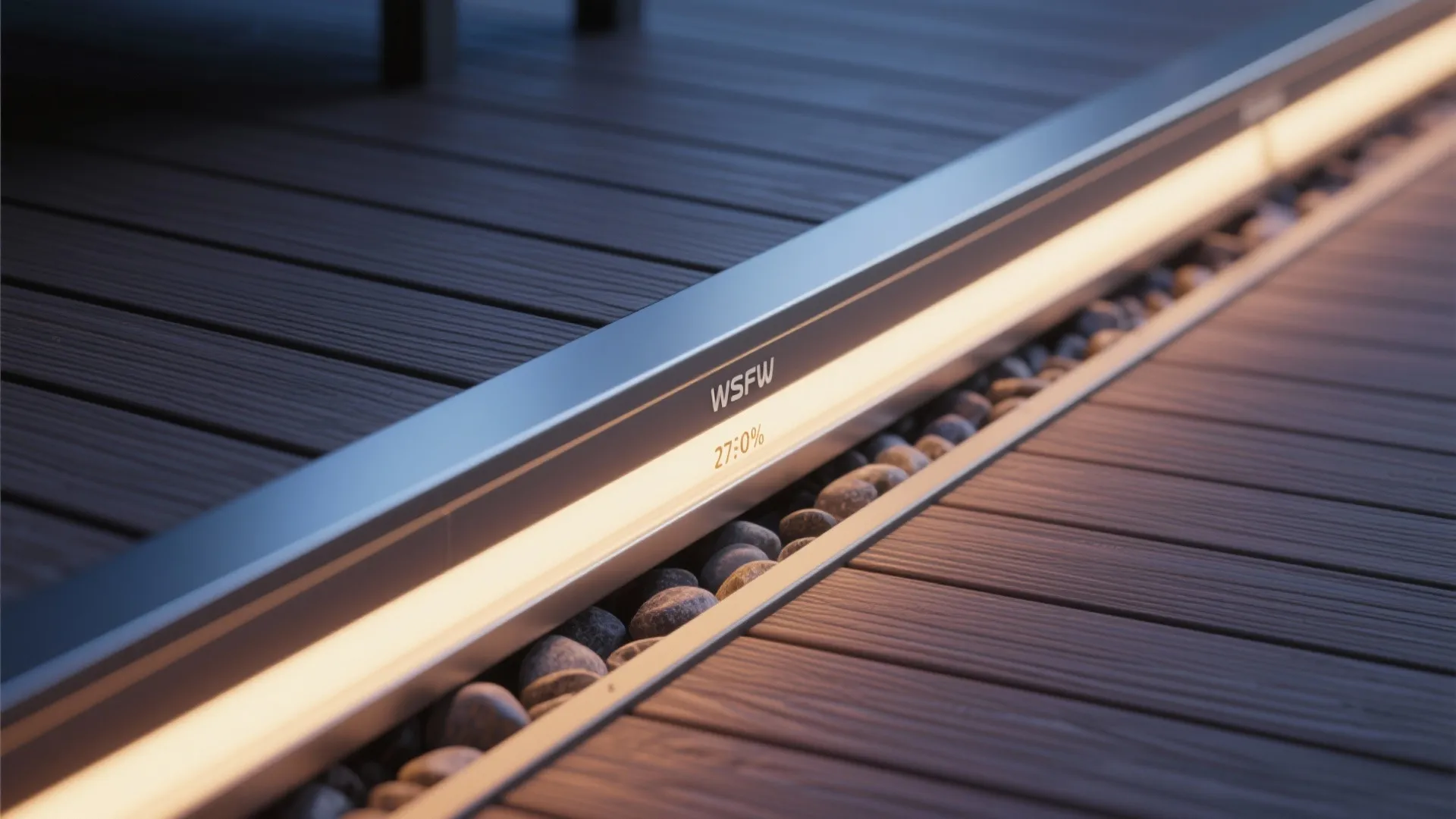 Macro of waterproof under-bench LED channel casting warm light on composite decking.