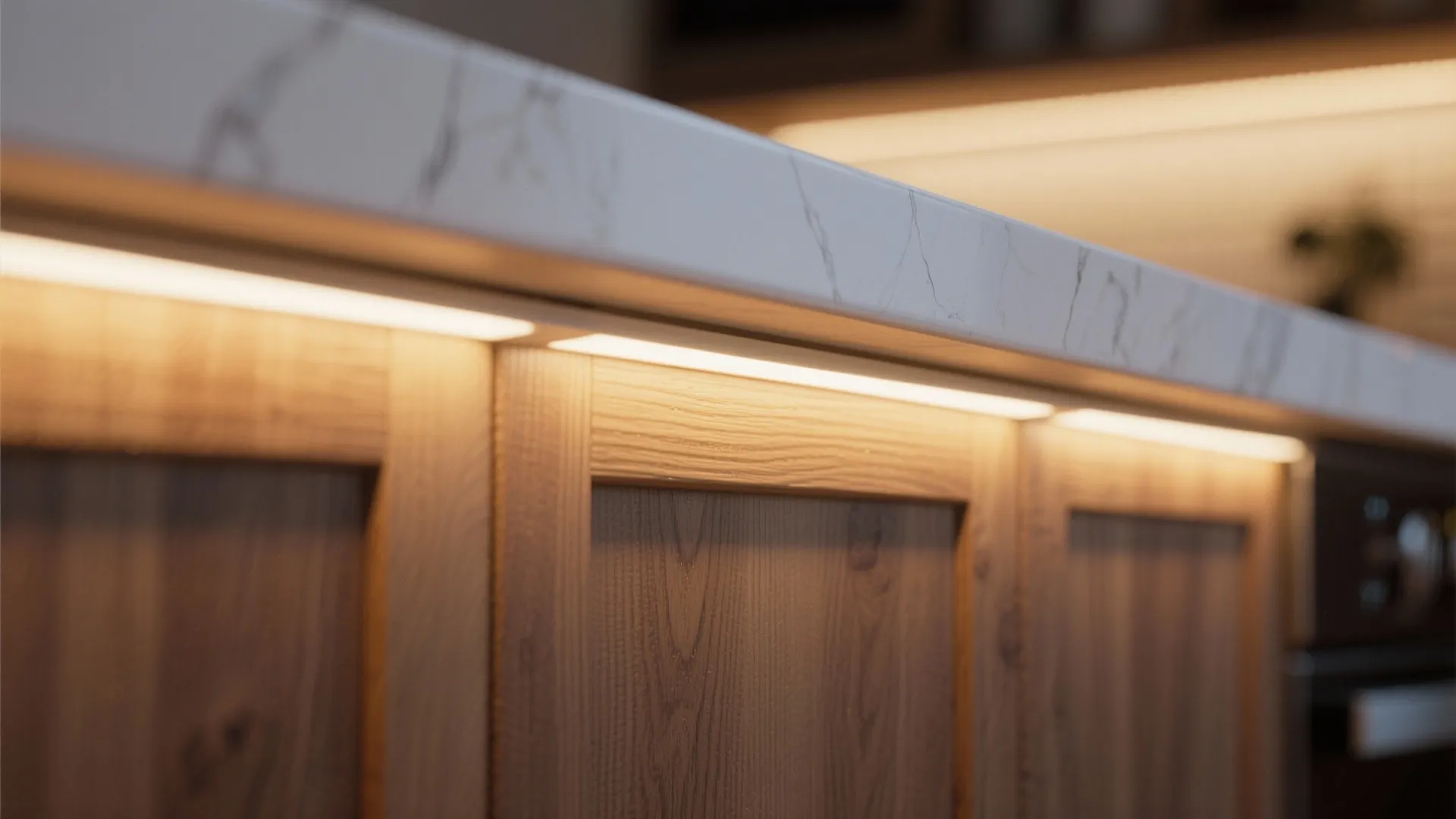 Warm yellow light strip installed under marble countertop on wood wall panel for kitchen decoration