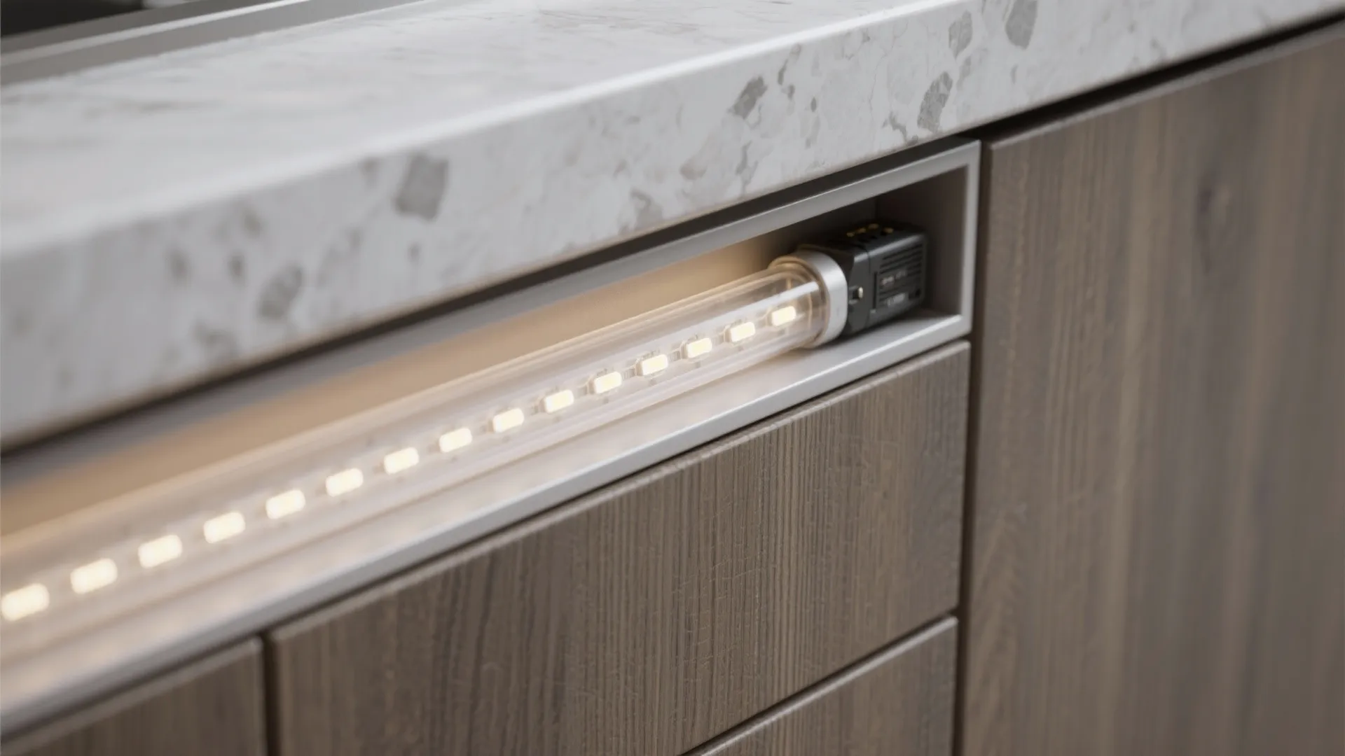 Close up view of LED light fixture installed inside a dark wood kitchen cabinet drawer