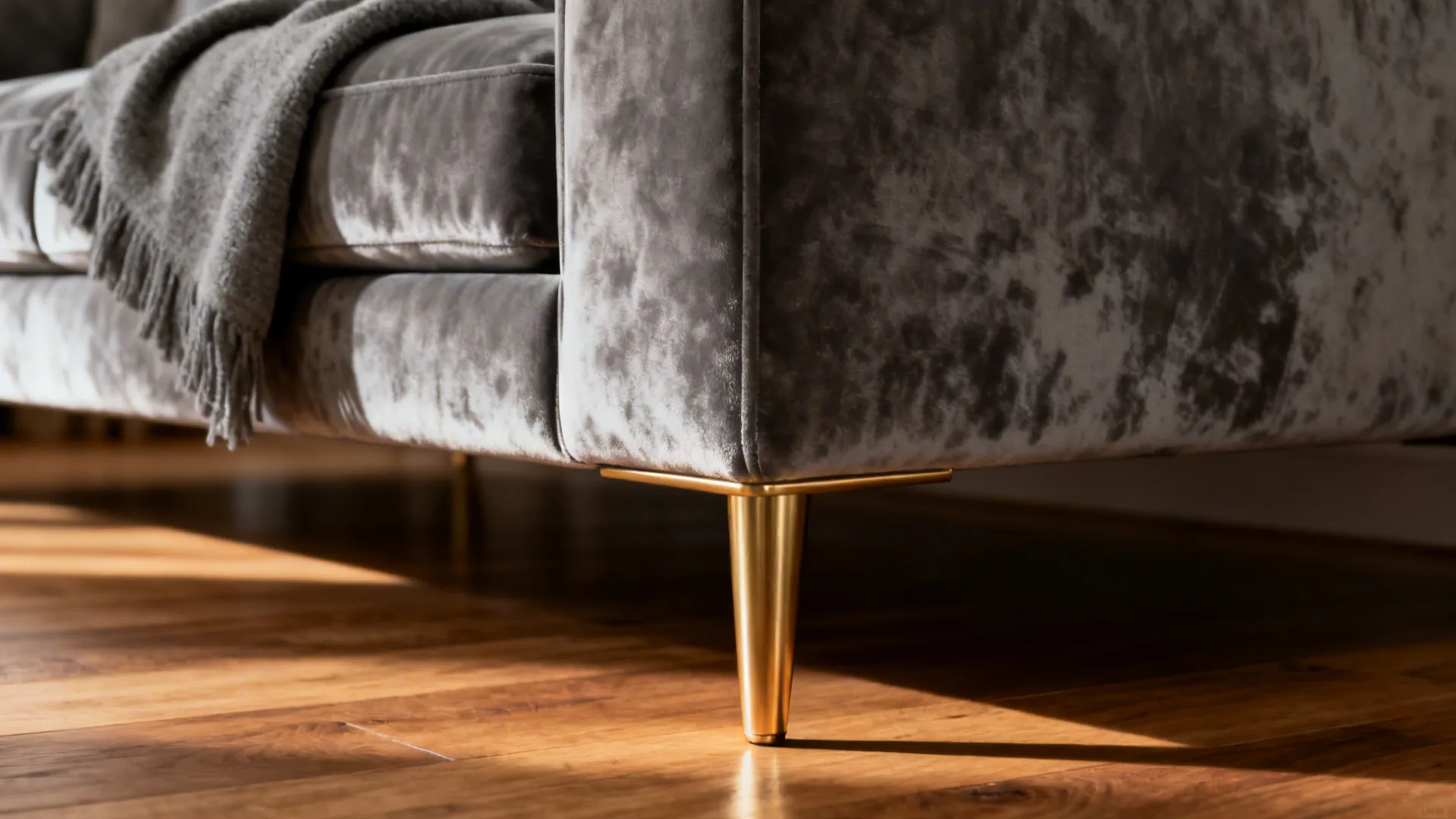 2. Velvet Grey Sofa with Gold Legs