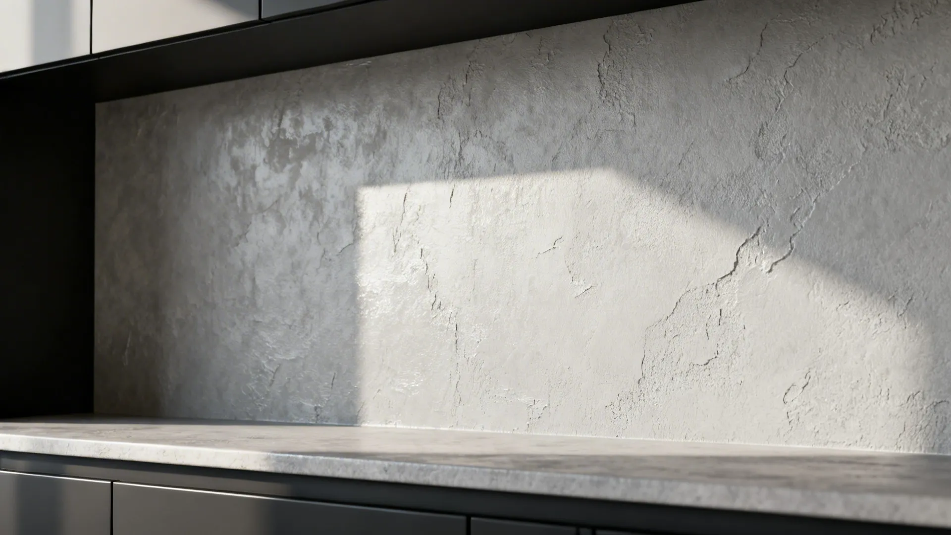 Textured Venetian plaster backsplash in light gray providing tactile contrast to dark cabinets