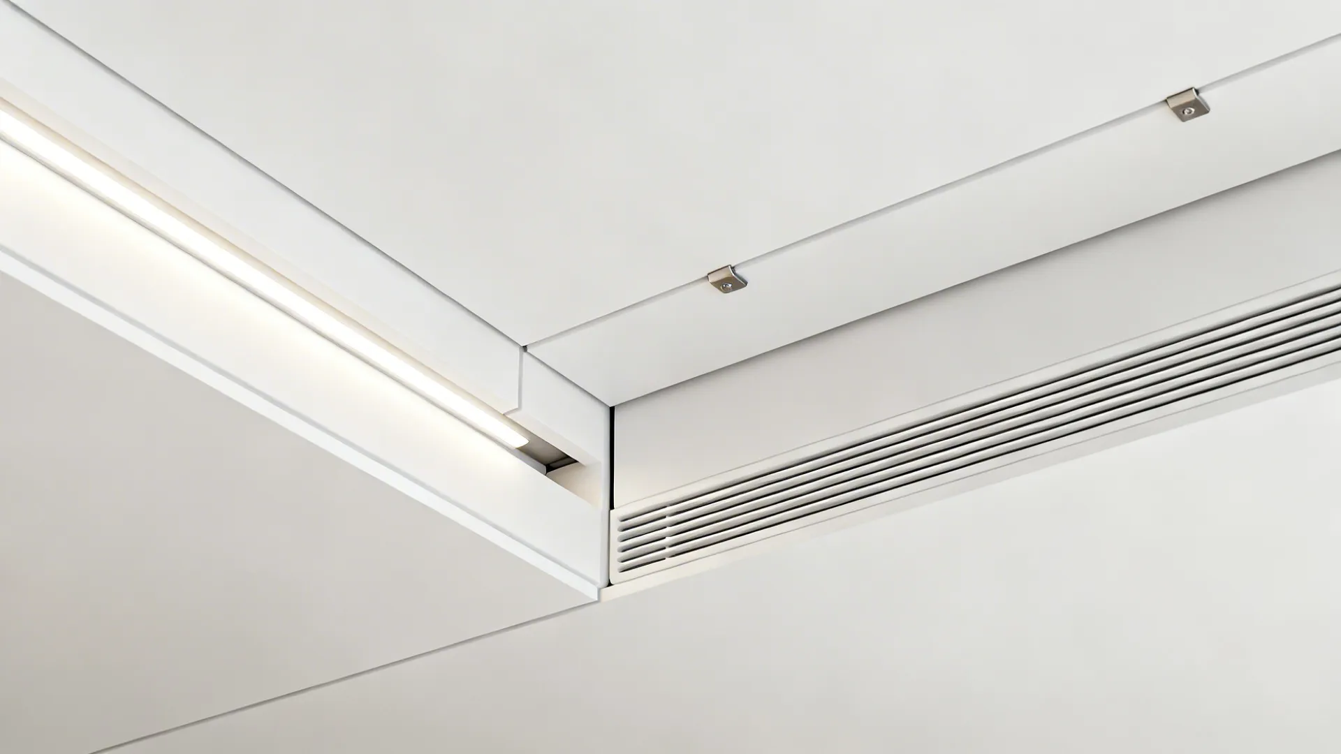 Close-up of a shallow ceiling recess with LED and a neat access panel seam for ventilation.