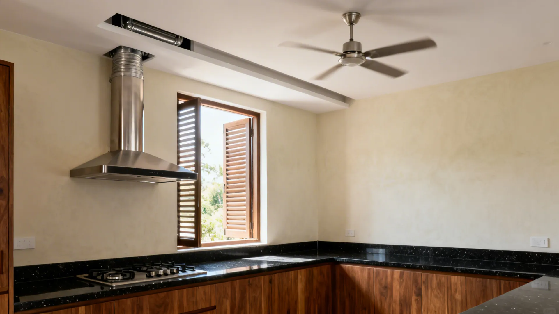 Compact kitchen with a ducted chimney and louvered window providing cross-ventilation.