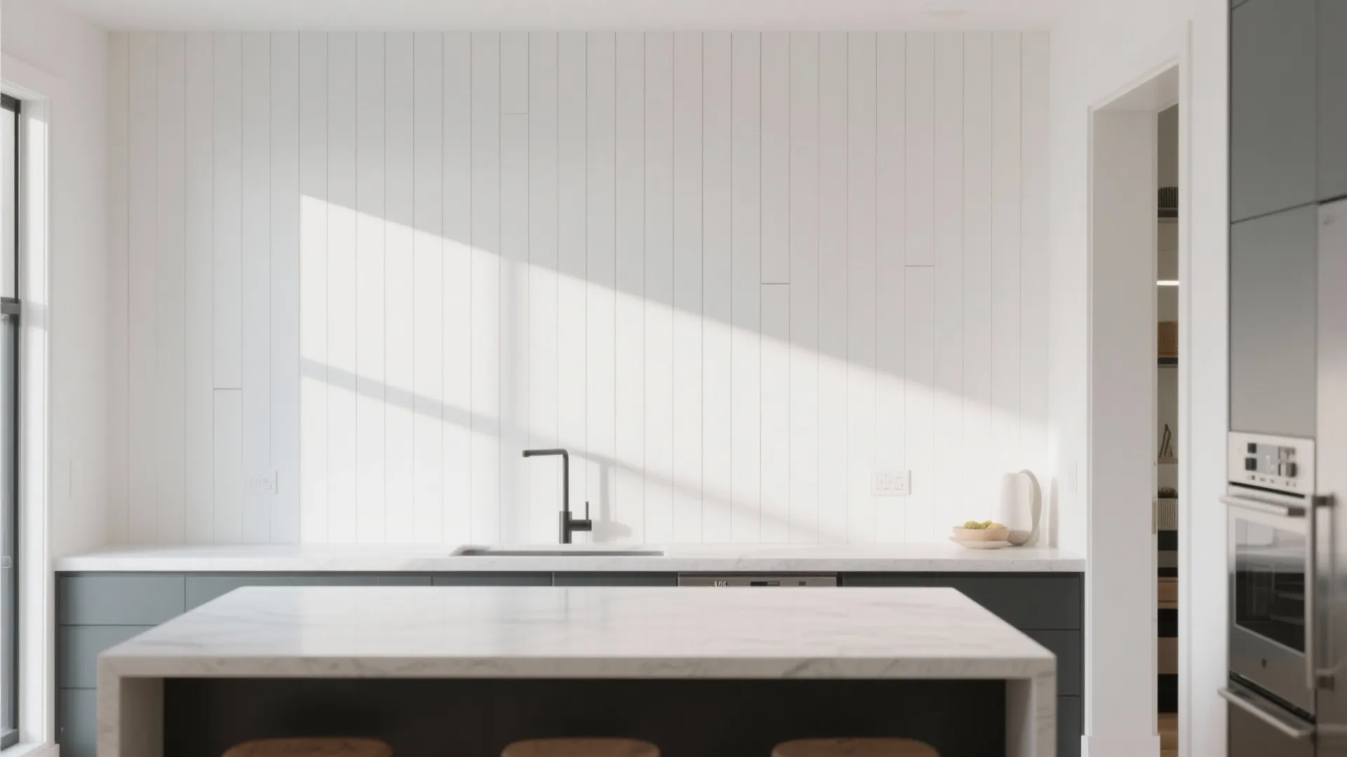 Minimalist kitchen featuring white wall panel design grey cabinets marble island and natural sunlight shadow