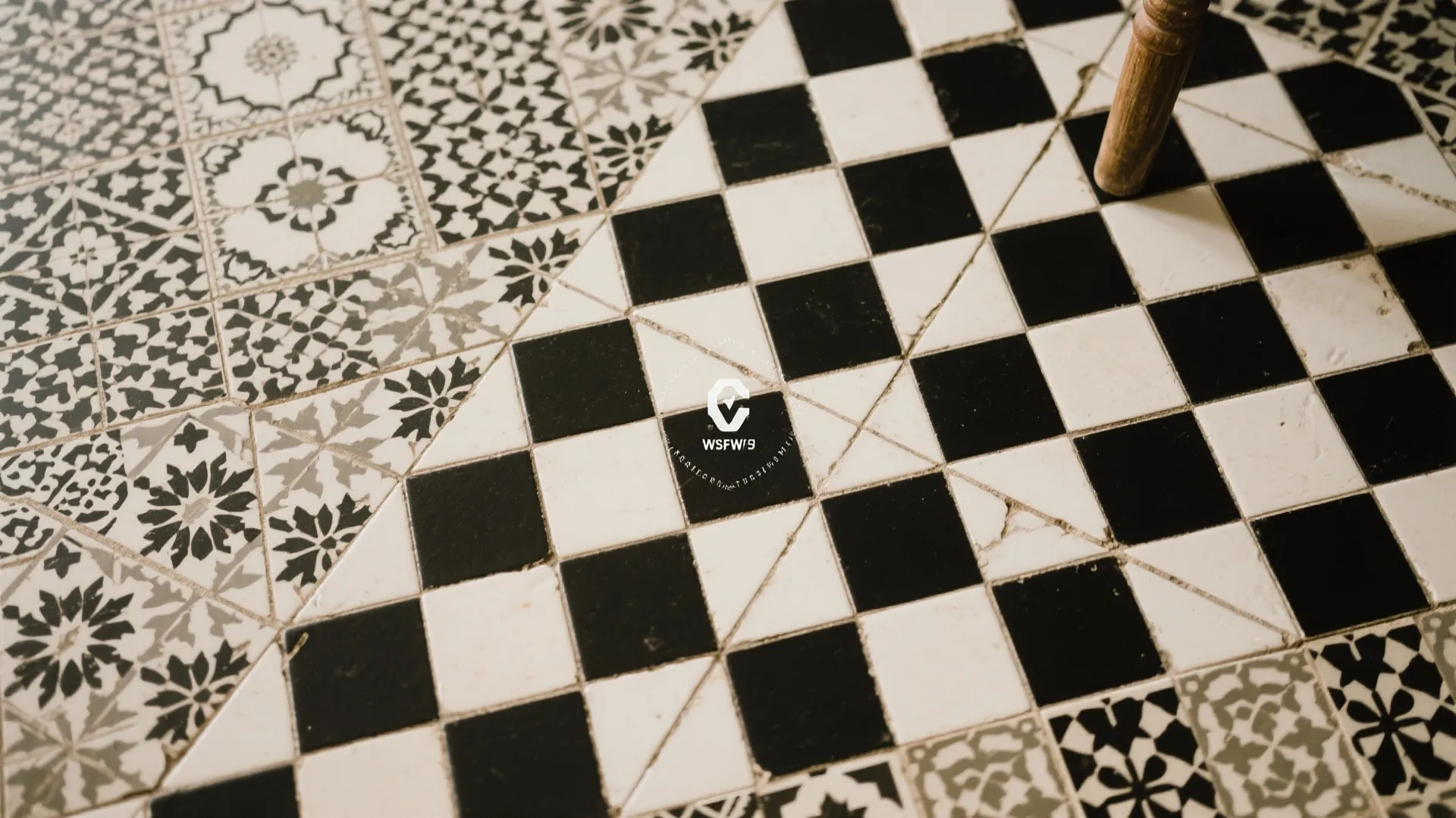 Traditional floor tiles with black and white checkered pattern and decorative floral designs for home flooring