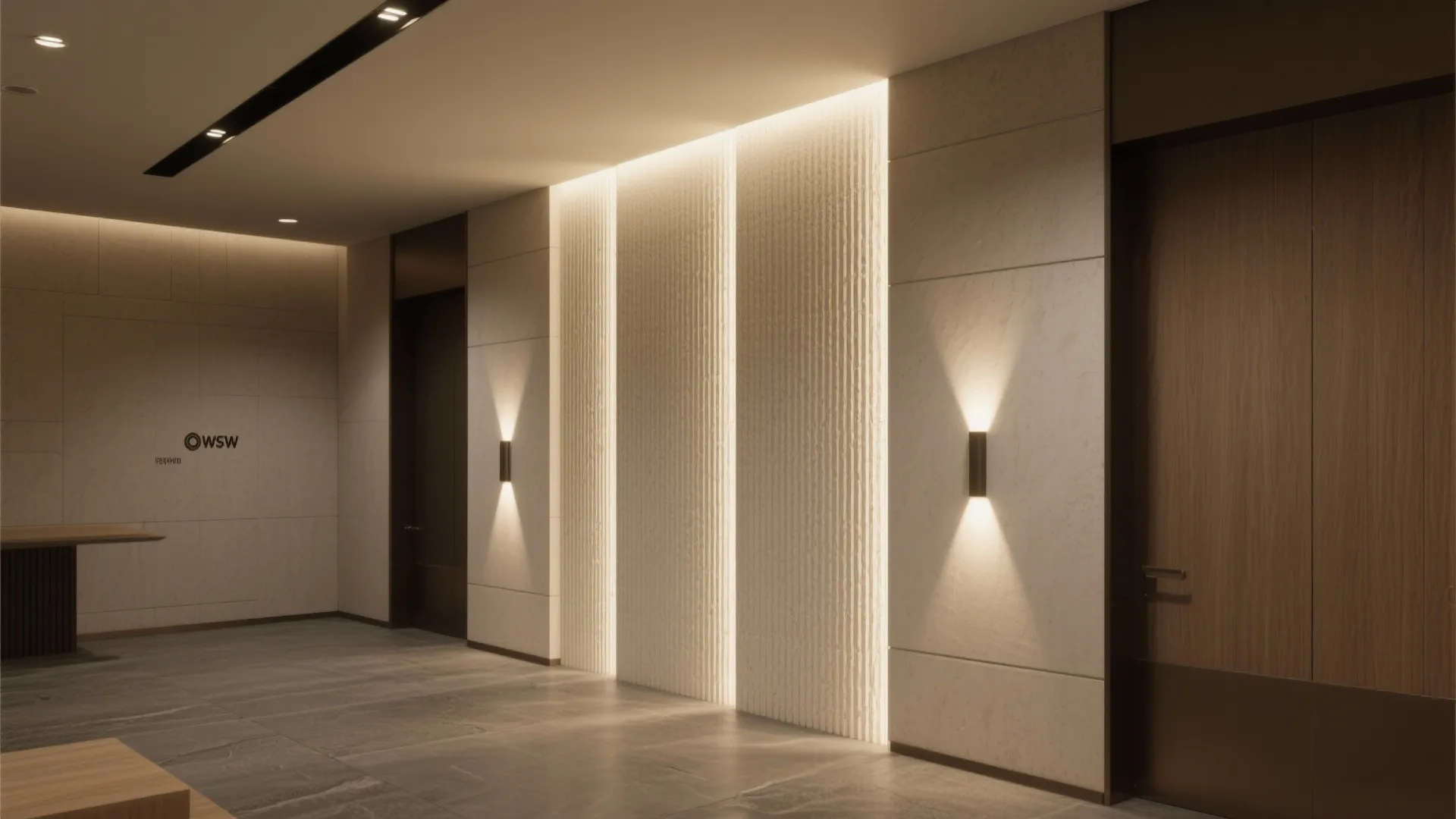 Small lobby with ribbed plaster feature wall dramatically lit by vertical wall grazers that enhance height.