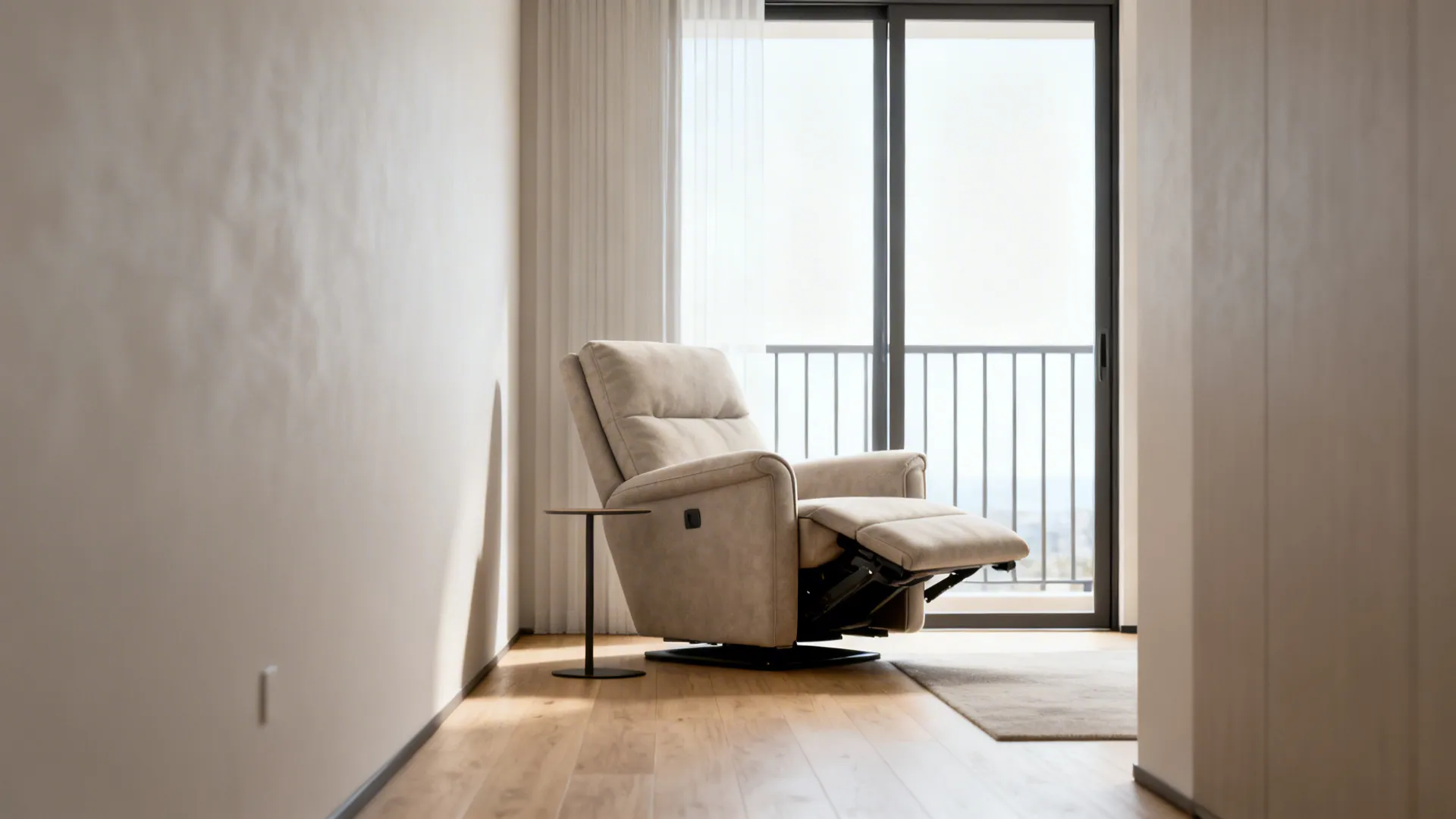 Wall-hugger recliner in a narrow living room with minimal clearance behind it near a balcony door.