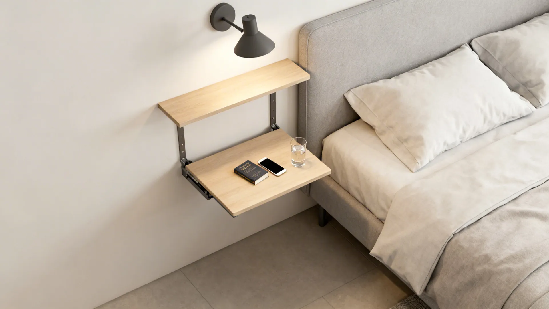 Floating bedside shelf and fold-down wall table freeing floor space in a compact bedroom.