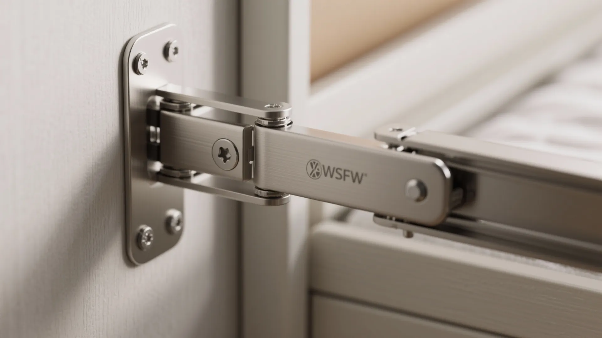 Close up of metal wall bed hinge hardware mechanism installed on a white wooden cabinet frame