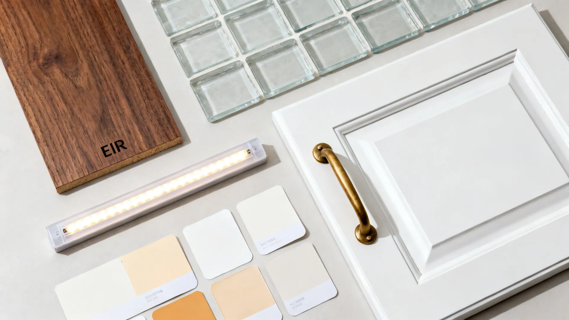Top-down material board with walnut vinyl plank and light cabinet finishes.